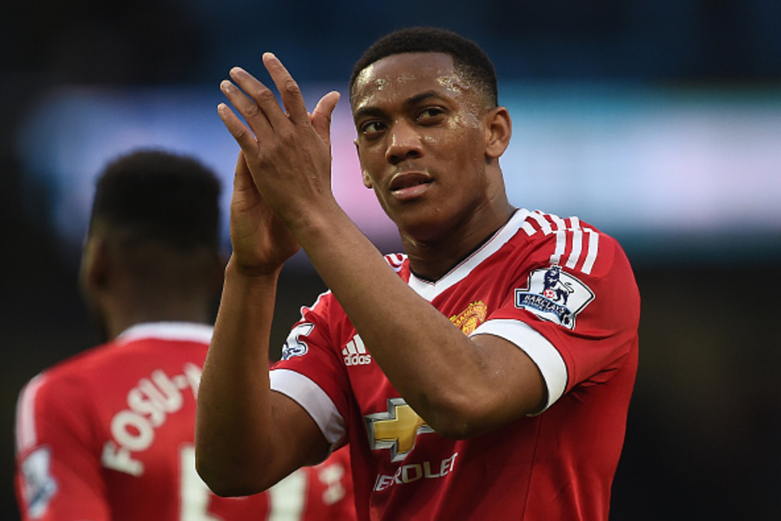 Manchester United's French striker Anthony Martial applauds the crowd following the English Premier League football match between Manchester City and Manchester United at the Etihad Stadium in Manchester, north west England, on March 20, 2016.
Manchester 