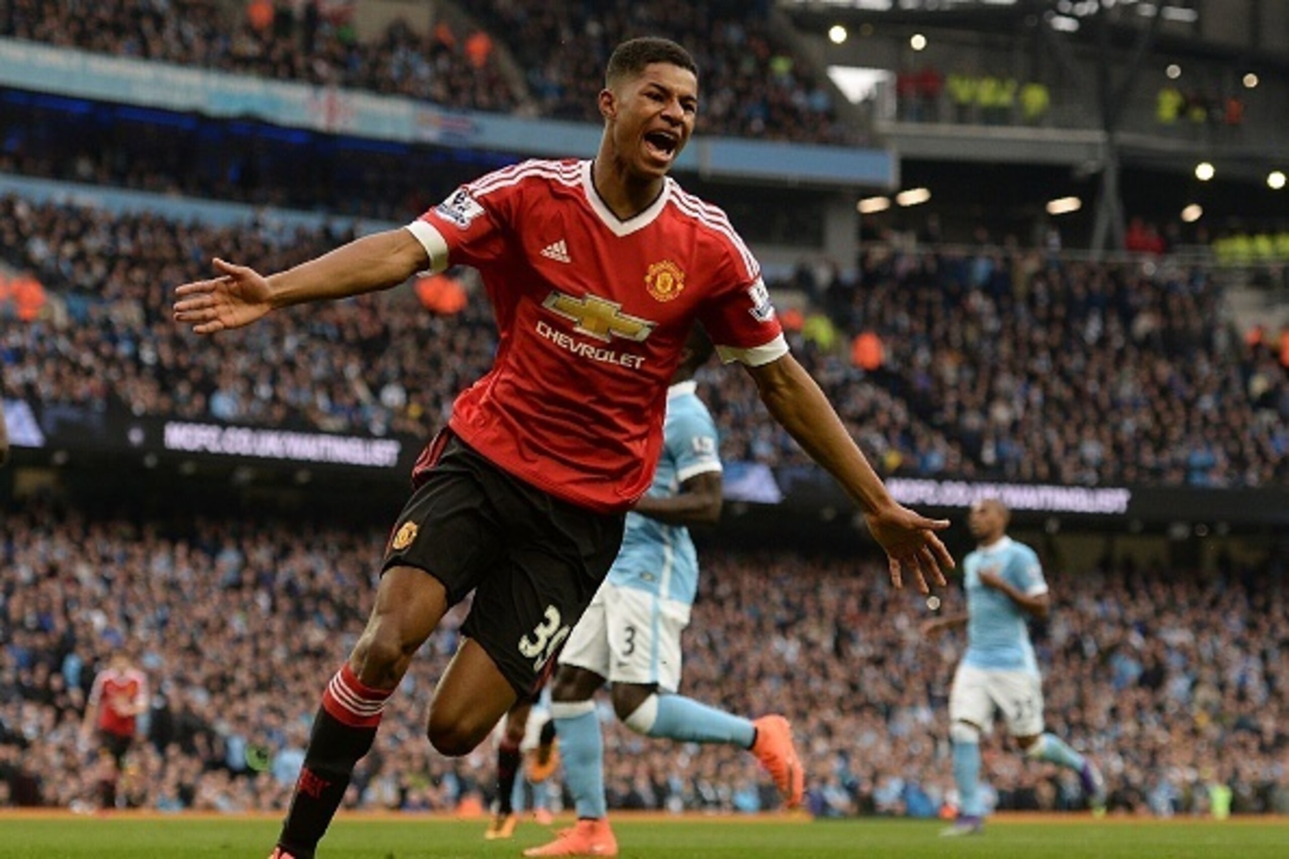 Manchester United's English striker Marcus Rashford celebrates scoring his team's first goal during the English Premier League football match between Manchester City and Manchester United at the Etihad Stadium in Manchester, north west England, on March 2