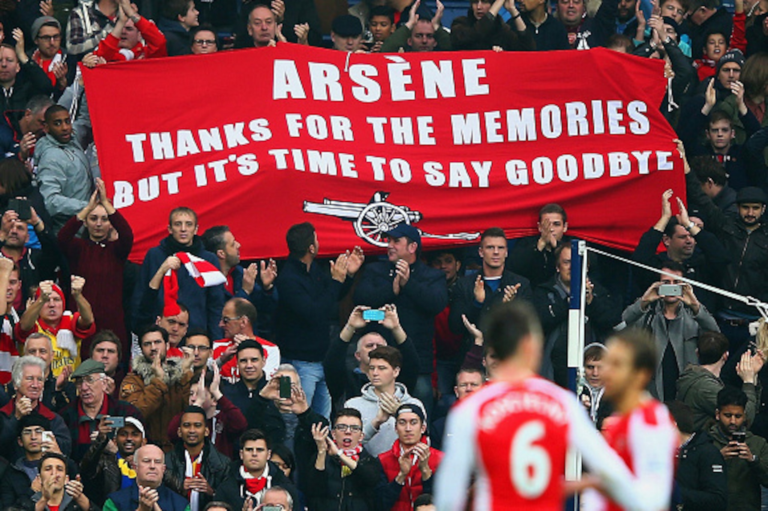 WEST BROMWICH, ENGLAND - NOVEMBER 29:   (EDITORS NOTE: This is a retransmission of image #459708260 with an alternative crop)   Arsenal fans hold up a banner for Arsene Wenger, manager of Arsenal during the Barclays Premier League match between West Bromw