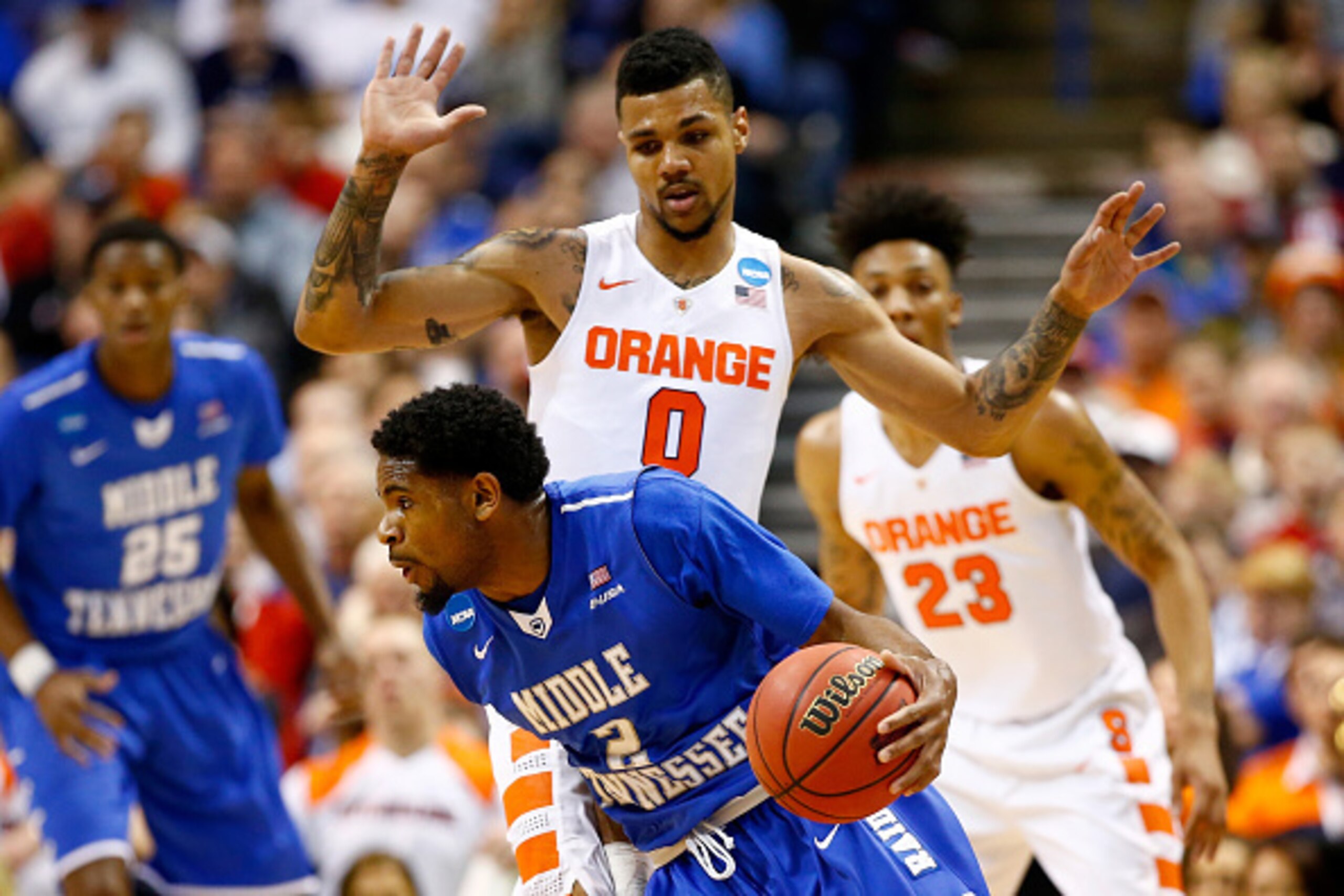 ST LOUIS, MO - MARCH 20: Perrin Buford #2 of the Middle Tennessee Blue Raiders handles the ball against Michael Gbinije #0 of the Syracuse Orange in the first half during the second round of the 2016 NCAA Men's Basketball Tournament at Scottrade Center on