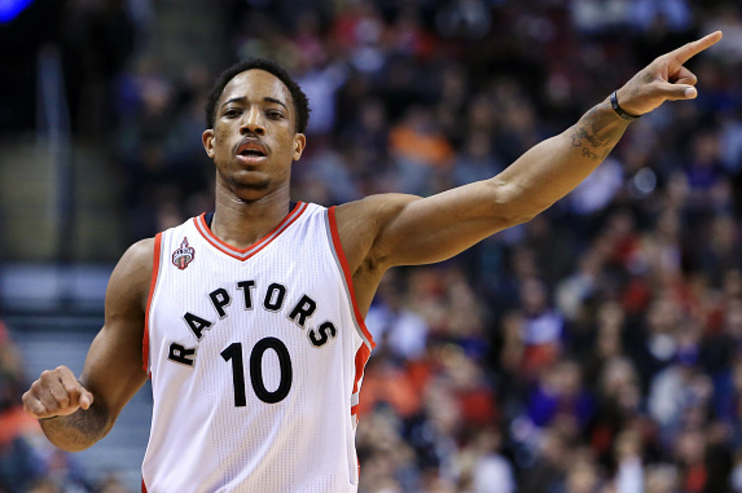 TORONTO, ON - MARCH 18:  DeMar DeRozan #10 of the Toronto Raptors gestures to teammates during the first half of an NBA game against the Boston Celtics at the Air Canada Centre on March 18, 2016 in Toronto, Ontario, Canada.  NOTE TO USER: User expressly a