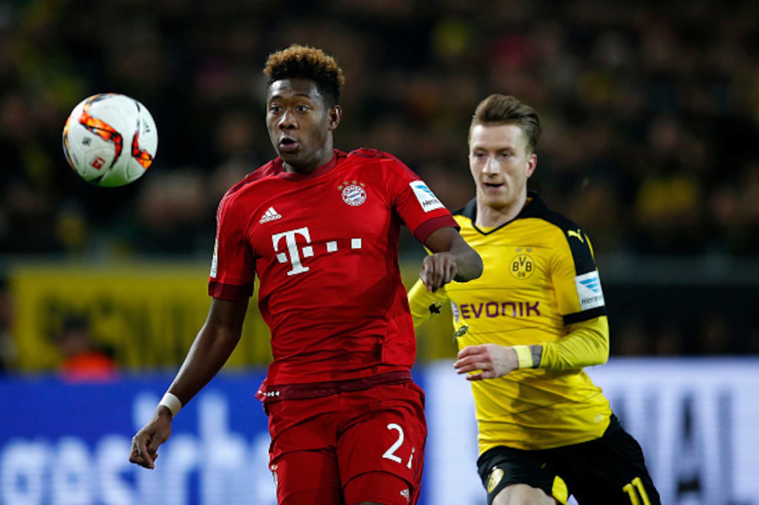 DORTMUND, GERMANY - MARCH 05:  Marco Reus (R) of Borussia Dortmund challenges David Alaba of Bayern Munich during the Bundesliga match between Borussia Dortmund and FC Bayern Muenchen at Signal Iduna Park on March 5, 2016 in Dortmund, Germany.bs  (Photo b