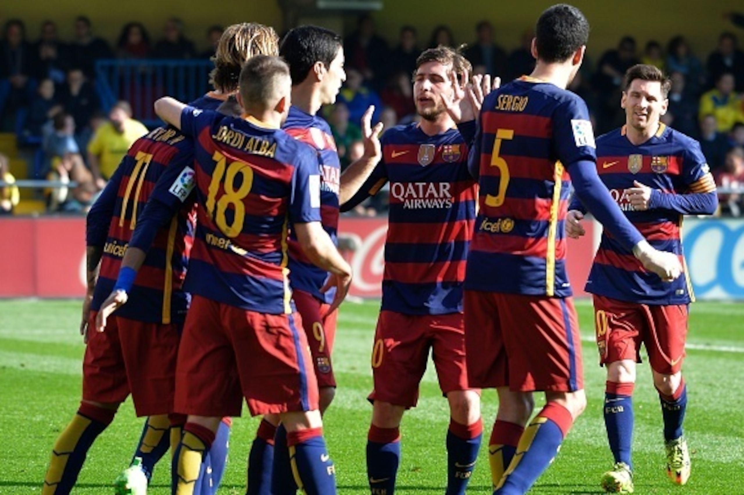 Barcelona's players celebrate a second goal during the Spanish league football match Villarreal CF vs FC Barcelona at El Madrigal stadium in Vila-real on March 20, 2016. / AFP / JOSE JORDAN        (Photo credit should read JOSE JORDAN/AFP/Getty Images)