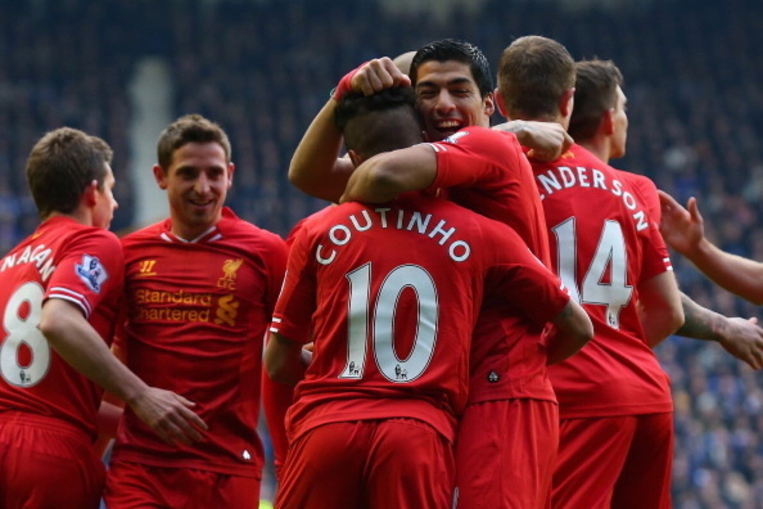LIVERPOOL, ENGLAND - NOVEMBER 23: Coutinho of Liverpool celebrates scoring the opening goal with Luis Suarez during the Barclays Premier League match between Everton and Liverpool at Goodison Park on November 23, 2013 in Liverpool, England. (Photo by Al LIVERPOOL, ENGLAND - NOVEMBER 23: Coutinho of Liverpool celebrates scoring the opening goal with Luis Suarez during the Barclays Premier League match between Everton and Liverpool at Goodison Park on November 23, 2013 in Liverpool, England. (Photo by Al