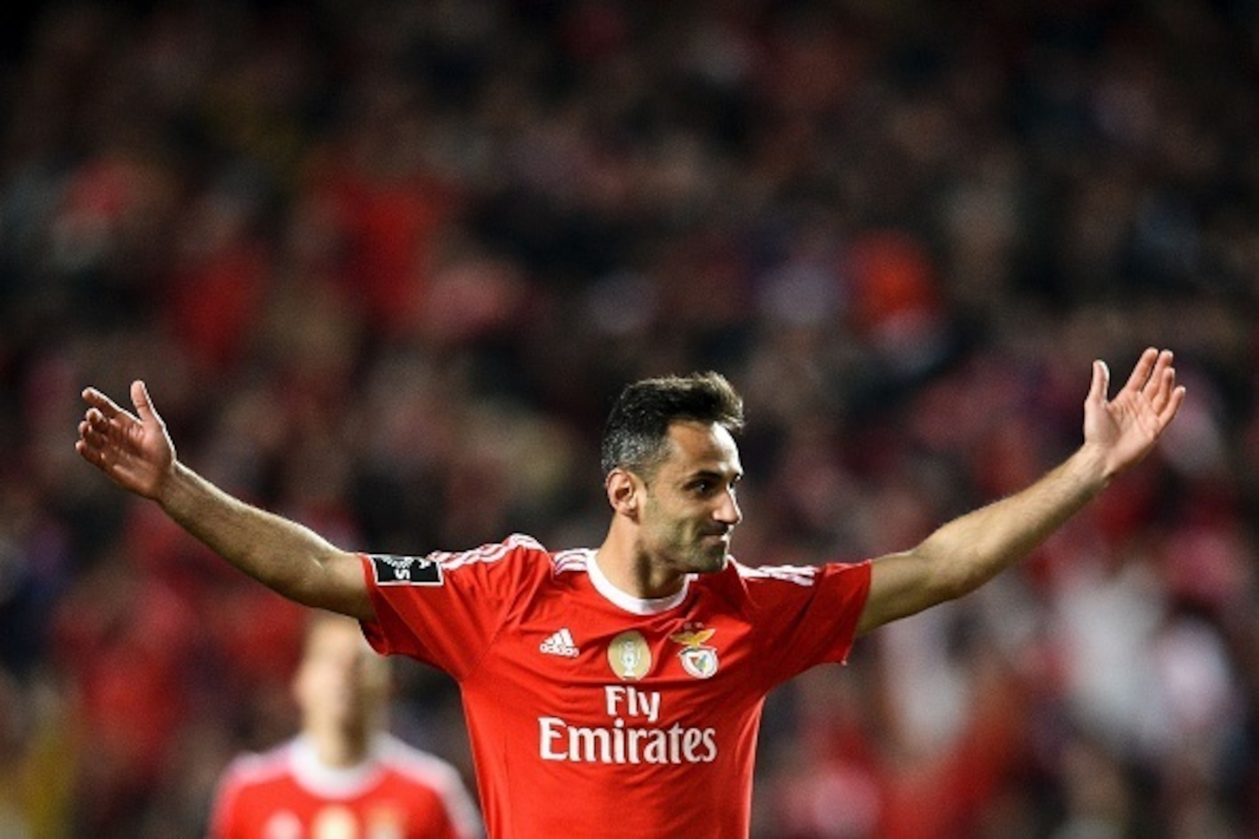 Benfica's Brazilian forward Jonas Oliveira celebrates after scoring during the Portuguese league football match SL Benfica vs Uniao Madeira at the Luz stadium in Lisbon on February 29, 2016. / AFP / PATRICIA DE MELO MOREIRA        (Photo credit should rea