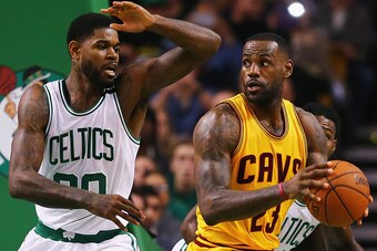 BOSTON, MA - DECEMBER 15:  Amir Johnson #90 of the Boston Celtics defends LeBron James #23 of the Cleveland Cavaliers during the third quarter at TD Garden on December 15, 2015 in Boston, Massachusetts. NOTE TO USER: User expressly acknowledges and agrees