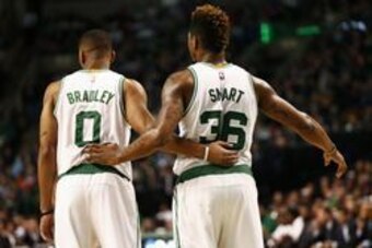 Feb 25, 2016; Boston, MA, USA; Boston Celtics guard Avery Bradley (0) and guard Marcus Smart (36) speak during the first half of a game against the Milwaukee Bucks at TD Garden. Mandatory Credit: Mark L. Baer-USA TODAY Sports