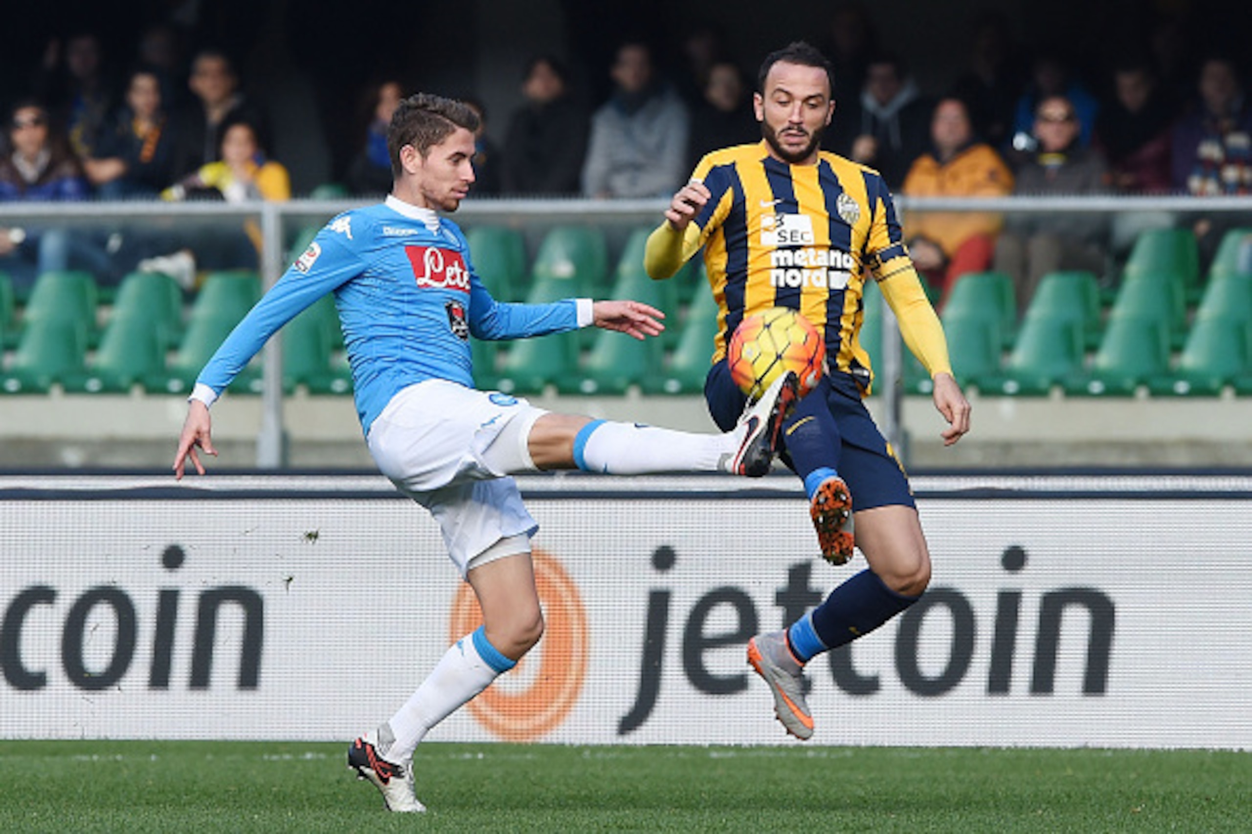 VERONA, ITALY - NOVEMBER 22: Napoli's player Jorginho vies with Hellas Verona player Giampaolo Pazzini during the Serie A match between Hellas Verona FC and SSC Napoli at Stadio MarcAntonio Bentegodi on November 22, 2015 in Verona, Italy. (Photo by France