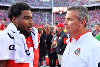COLUMBUS, OH - SEPTEMBER 12:  Braxton Miller #1 of the Ohio State Buckeyes talks with Head Coach Urban Meyer of the Ohio State Buckeyes after their game against the Hawaii Rainbow Warriors at Ohio Stadium on September 12, 2015 in Columbus, Ohio. Ohio Stat