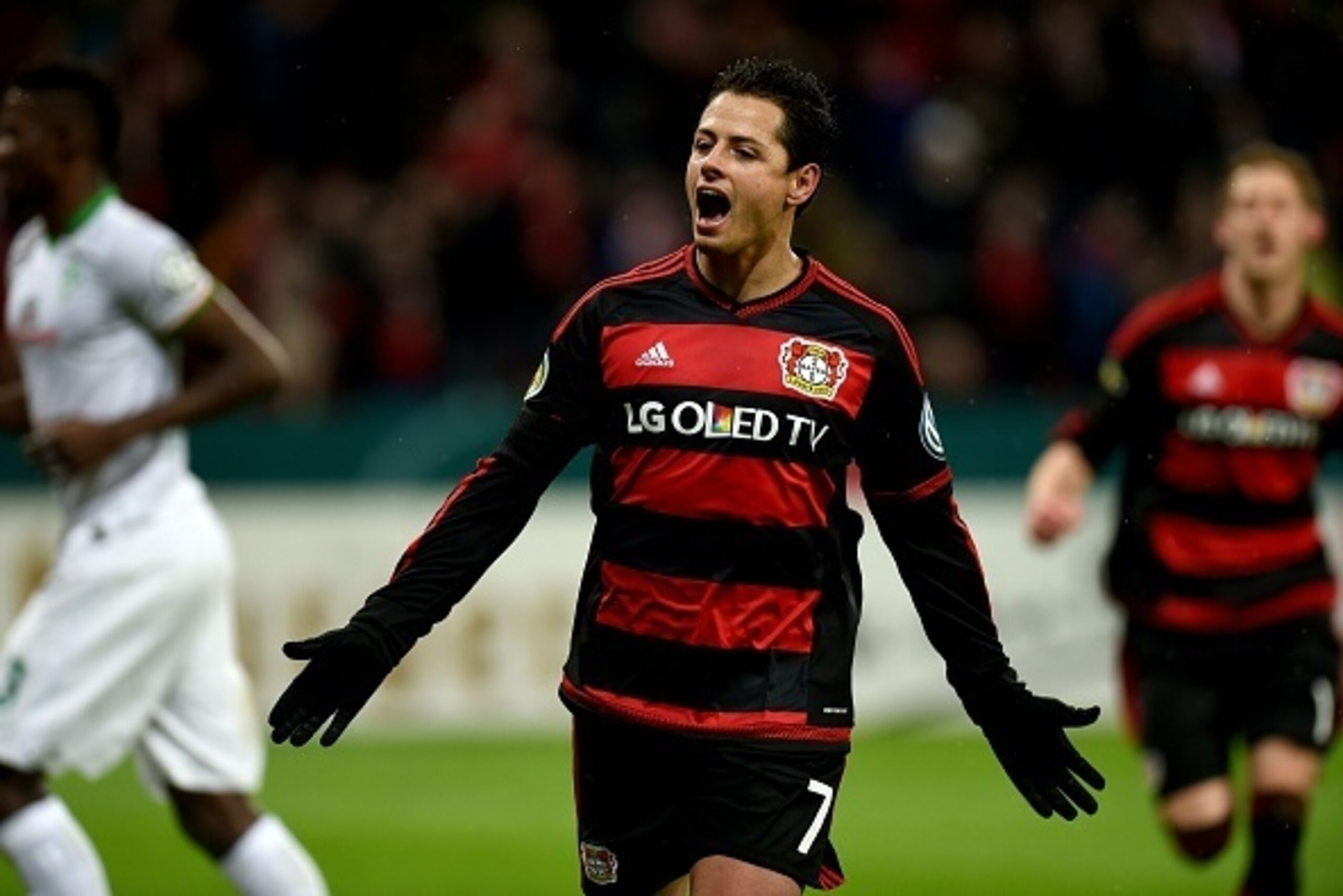 Leverkusen's Mexican striker Javier Hernandez celebrates after a goal during the German Cup (Pokal) quarter final football match Bayern 04 Leverkusen v SV Werder Bremen on February 9, 2016 in Leverkusen.
  / AFP / PATRIK STOLLARZ / RESTRICTIONS: ACCORDING