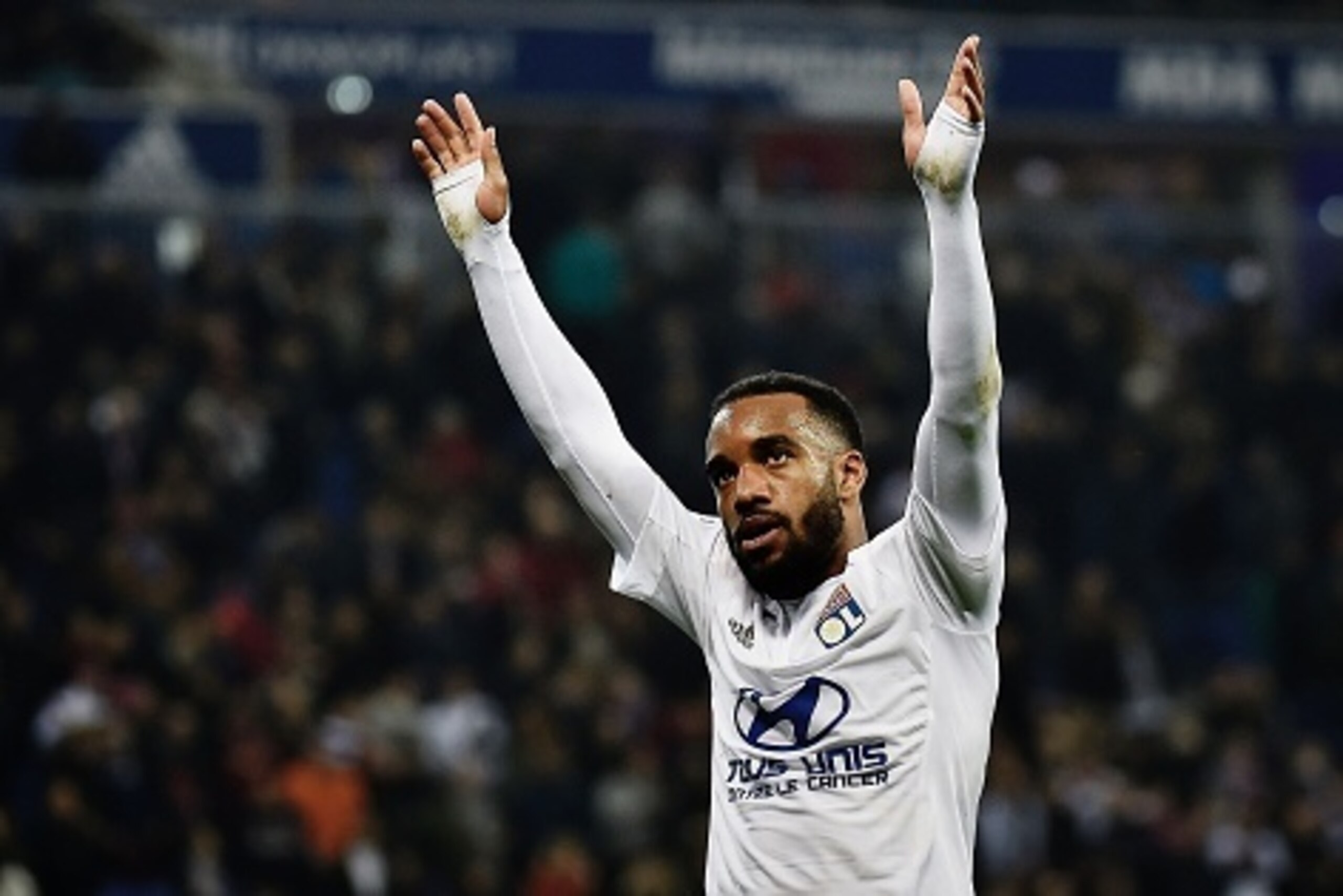 Lyon's French forward Alexandre Lacazette celebrates after scoring a goal during the French L1 football match between Lyon and Nantes at the New Stadium in Decines-Charpieu, central-eastern France, on March 19, 2016. AFP PHOTO / JEFF PACHOUD / AFP / JEFF 