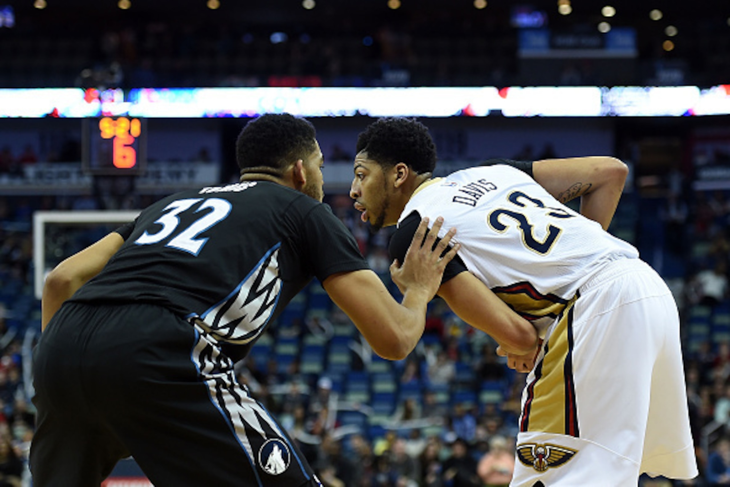 NEW ORLEANS, LA - JANUARY 19:  Anthony Davis #23 of the New Orleans Pelicans works against Karl-Anthony Towns #32 of the Minnesota Timberwolves during the first half of a game at the Smoothie King Center on January 19, 2016 in New Orleans, Louisiana. New 
