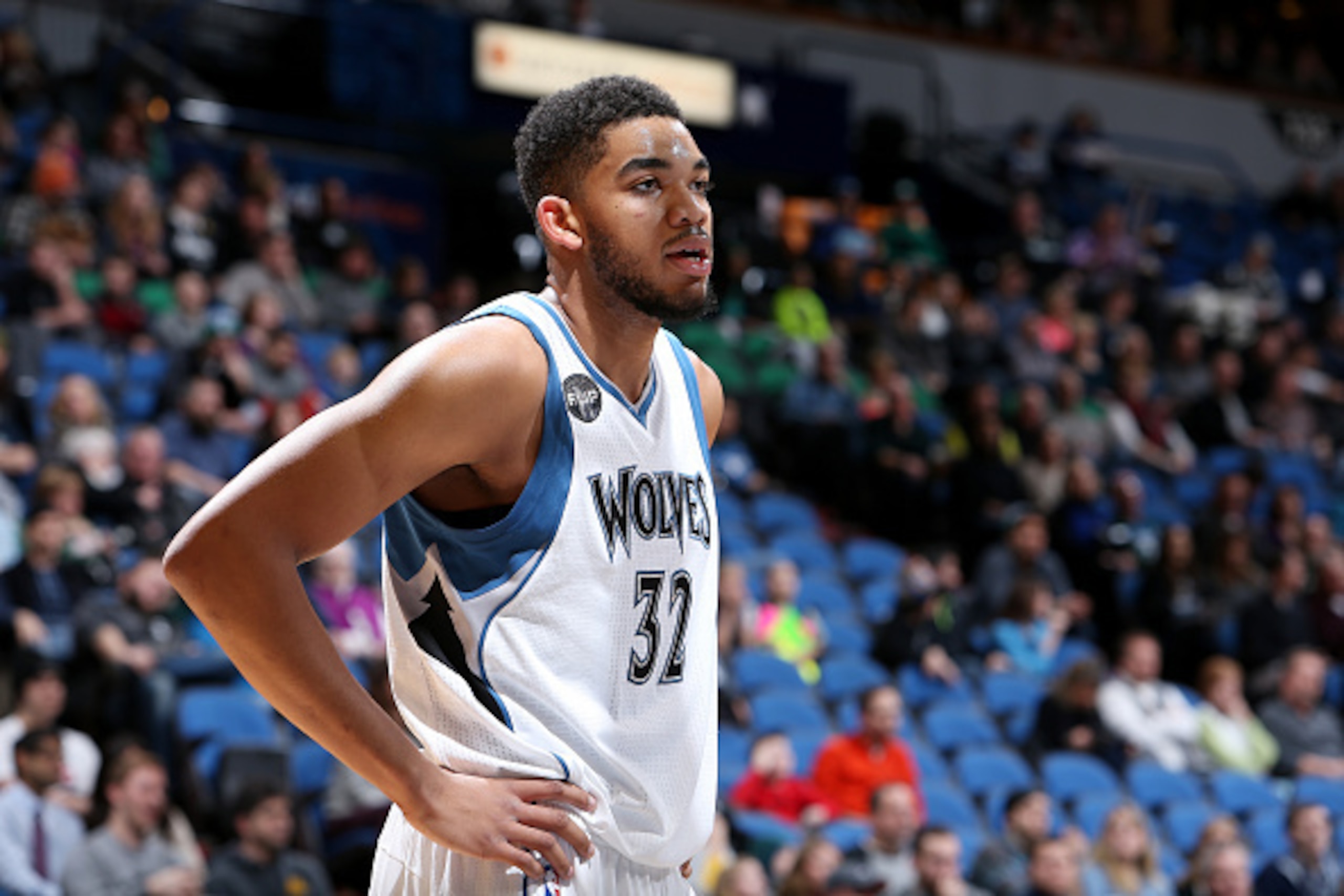 MINNEAPOLIS, MN - JANUARY 17: Karl-Anthony Towns #32 of the Minnesota Timberwolves looks on during the game against the Phoenix Suns on January 17, 2016 at Target Center in Minneapolis, Minnesota. NOTE TO USER: User expressly acknowledges and agrees that,