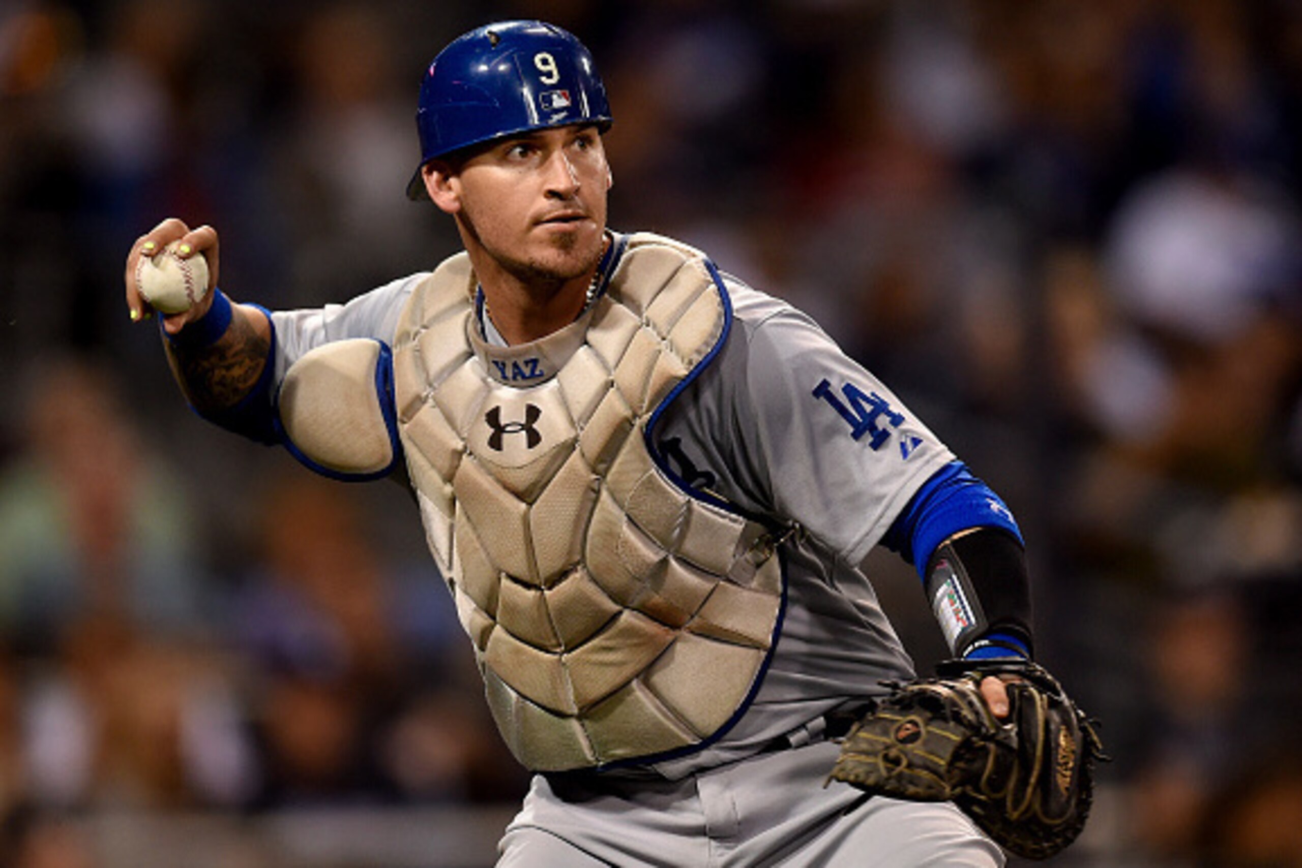 SAN DIEGO, CA - SEPTEMBER 4: Yasmani Grandal #9 of the Los Angeles Dodgers fields a bunt and throws to first base during the game against the San Diego Padres at Petco Park on September 4, 2015 in San Diego, California. (Photo by Andy Hayt/San Diego Padre SAN DIEGO, CA - SEPTEMBER 4: Yasmani Grandal #9 of the Los Angeles Dodgers fields a bunt and throws to first base during the game against the San Diego Padres at Petco Park on September 4, 2015 in San Diego, California. (Photo by Andy Hayt/San Diego Padre