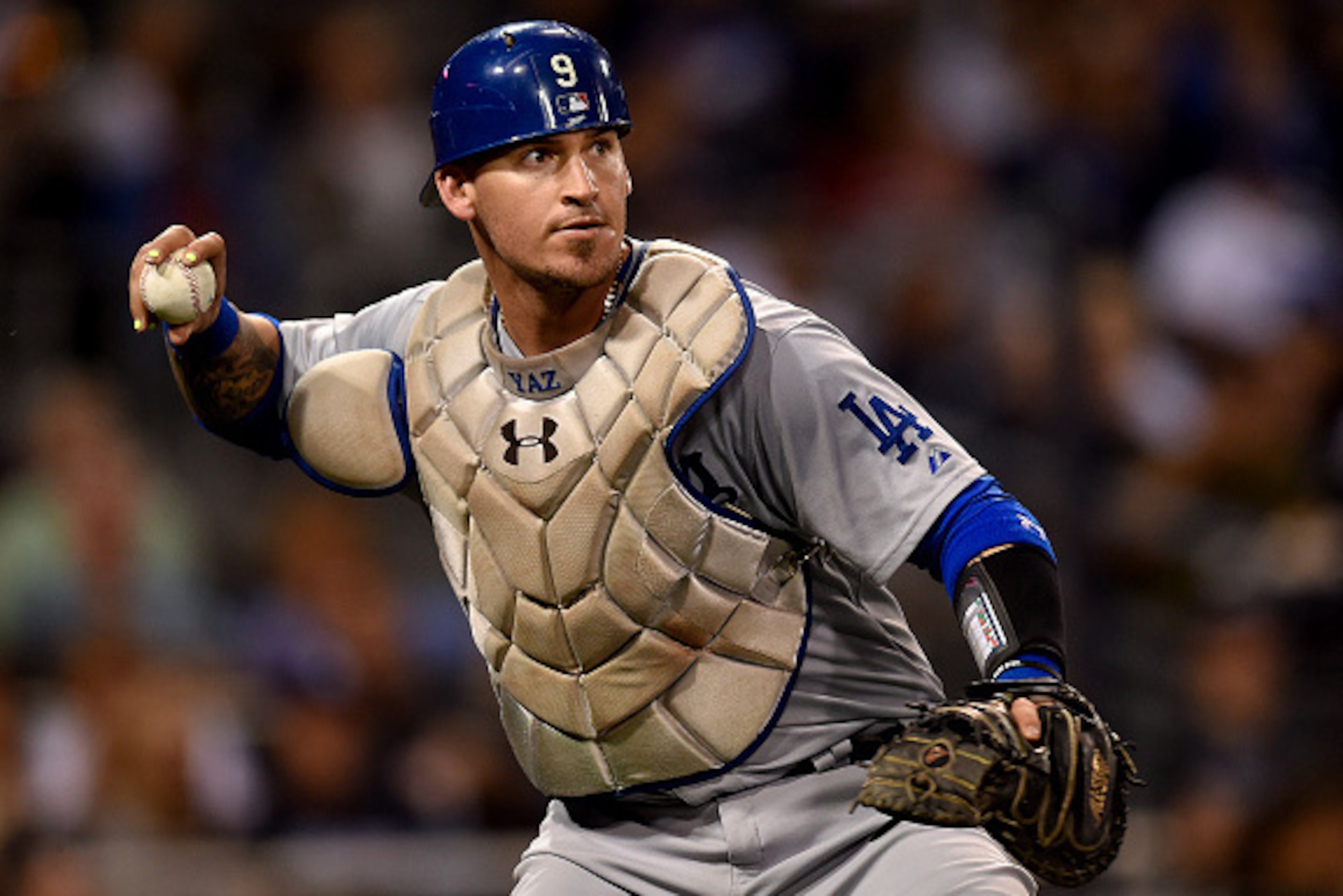 SAN DIEGO, CA - SEPTEMBER 4: Yasmani Grandal #9 of the Los Angeles Dodgers fields a bunt and throws to first base during the game against the San Diego Padres at Petco Park on September 4, 2015 in San Diego, California. (Photo by Andy Hayt/San Diego Padre SAN DIEGO, CA - SEPTEMBER 4: Yasmani Grandal #9 of the Los Angeles Dodgers fields a bunt and throws to first base during the game against the San Diego Padres at Petco Park on September 4, 2015 in San Diego, California. (Photo by Andy Hayt/San Diego Padre