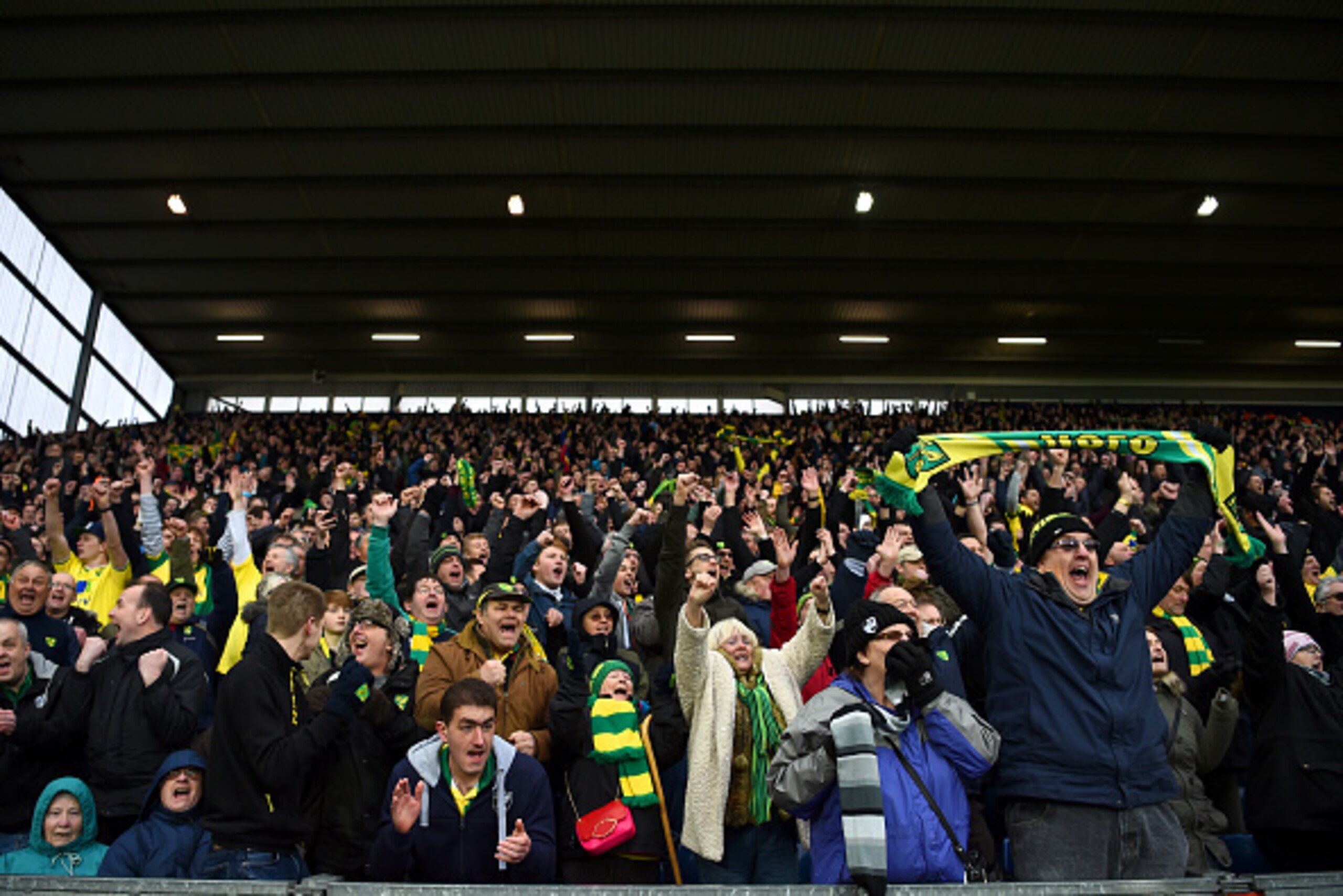 WEST BROMWICH, ENGLAND - MARCH 19: Norwich City supporters celerbate their team's 1-0 win in the Barclays Premier League match between West Bromwich Albion and Norwich City at The Hawthorns on March 19, 2016 in West Bromwich, United Kingdom. (Photo by L WEST BROMWICH, ENGLAND - MARCH 19: Norwich City supporters celerbate their team's 1-0 win in the Barclays Premier League match between West Bromwich Albion and Norwich City at The Hawthorns on March 19, 2016 in West Bromwich, United Kingdom. (Photo by L