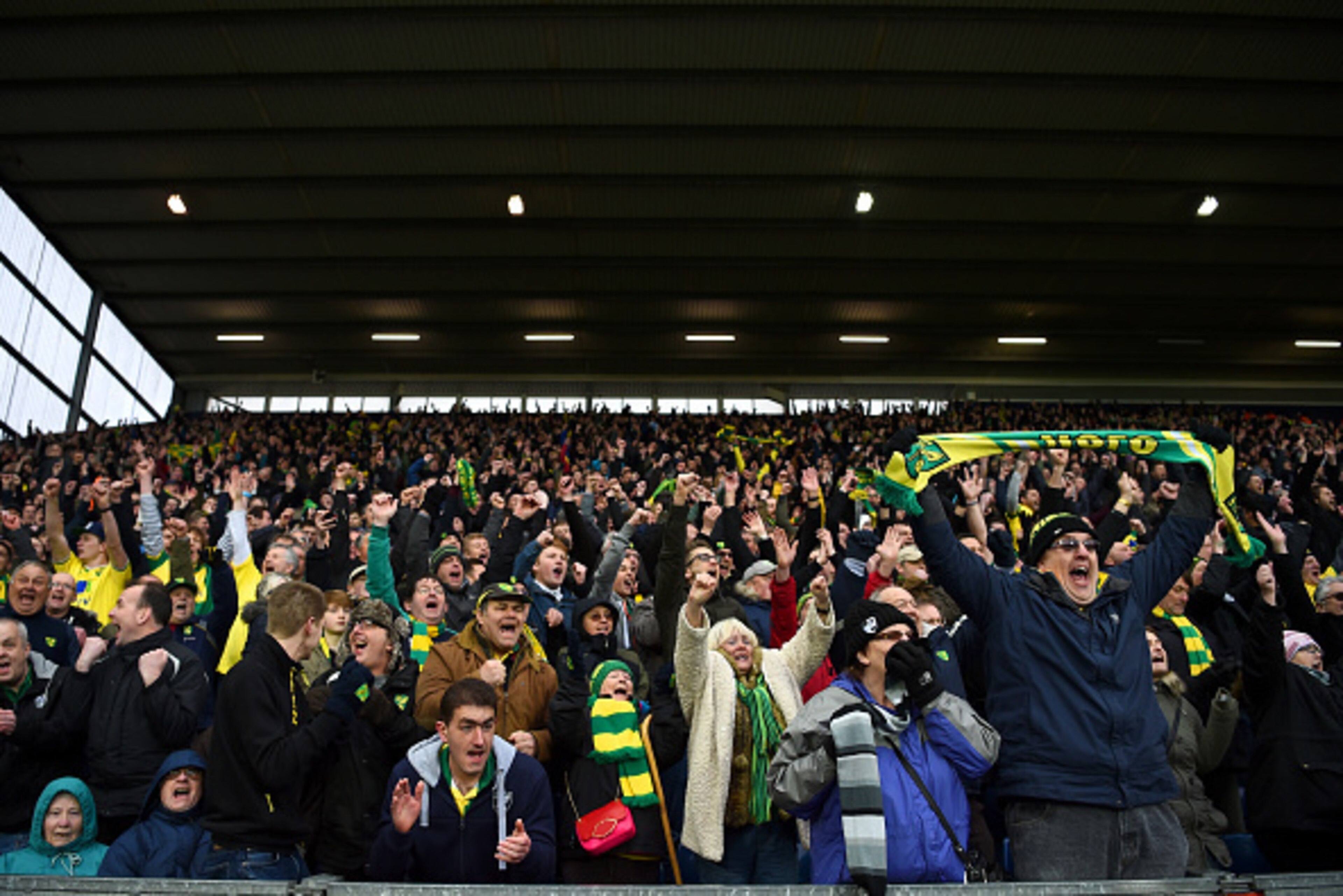 WEST BROMWICH, ENGLAND - MARCH 19:  Norwich City supporters celerbate their team's 1-0 win in the Barclays Premier League match between West Bromwich Albion and Norwich City at The Hawthorns on March 19, 2016 in West Bromwich, United Kingdom.  (Photo by L