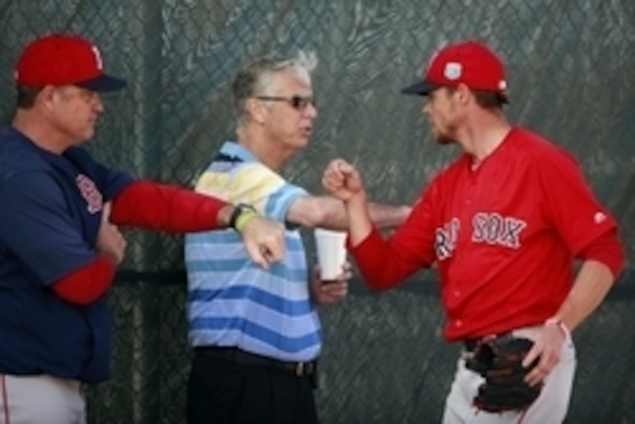 Feb 20, 2016; Lee County, FL, USA; Boston Red Sox starting pitcher Clay Buchholz (11) bumps fists with manager John Farrell (53) and president of baseball operations Dave Dombrowski as he works out at Jet Blue Park. Mandatory Credit: Kim Klement-USA TODAY Feb 20, 2016; Lee County, FL, USA; Boston Red Sox starting pitcher Clay Buchholz (11) bumps fists with manager John Farrell (53) and president of baseball operations Dave Dombrowski as he works out at Jet Blue Park. Mandatory Credit: Kim Klement-USA TODAY