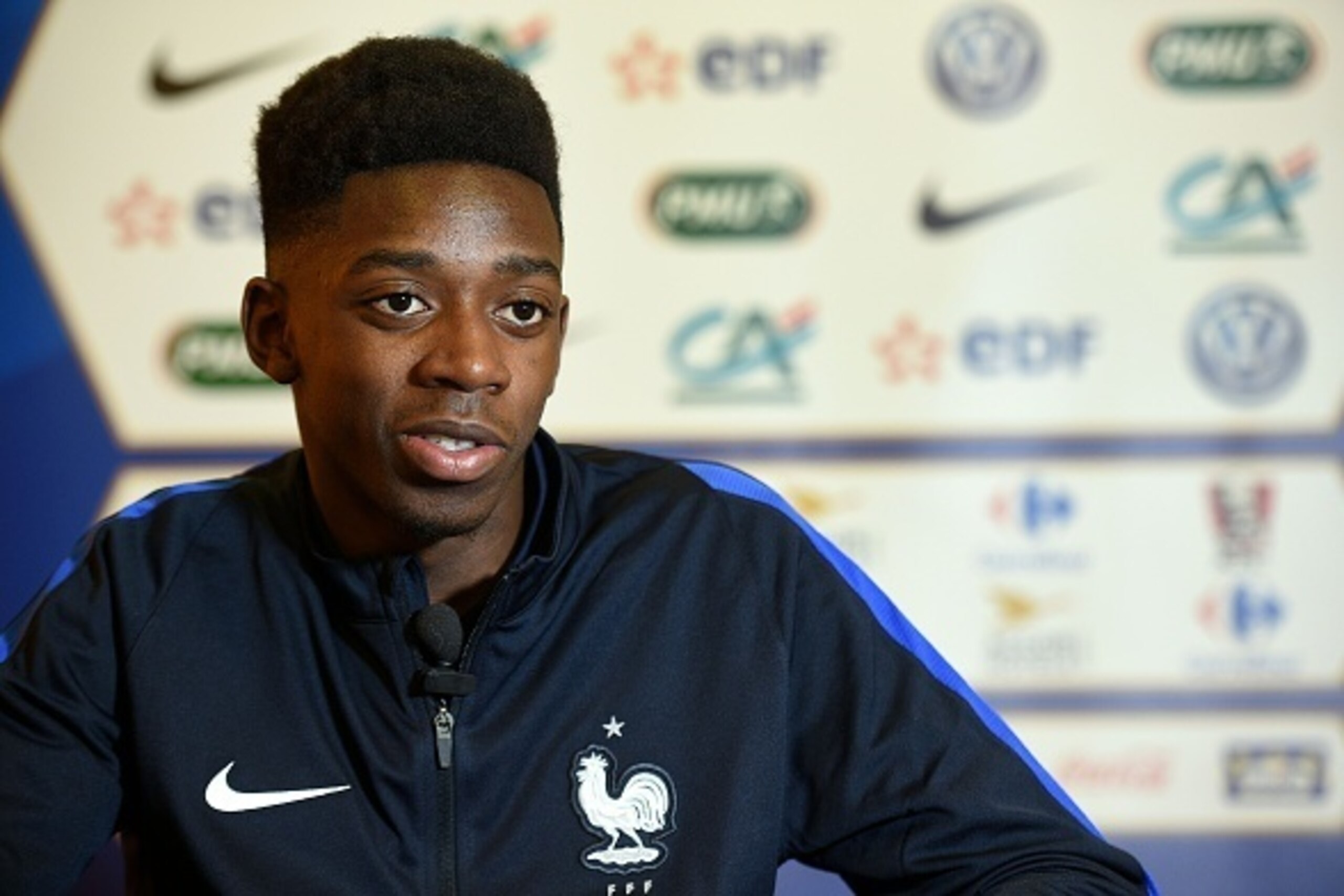 France's 'Espoirs' forward Ousmane Dembele, answers journalists' questions at the French national football team training base in Clairefontaine on March 21, 2016. / AFP / FRANCK FIFE (Photo credit should read FRANCK FIFE/AFP/Getty Images) France's 'Espoirs' forward Ousmane Dembele, answers journalists' questions at the French national football team training base in Clairefontaine on March 21, 2016. / AFP / FRANCK FIFE (Photo credit should read FRANCK FIFE/AFP/Getty Images)