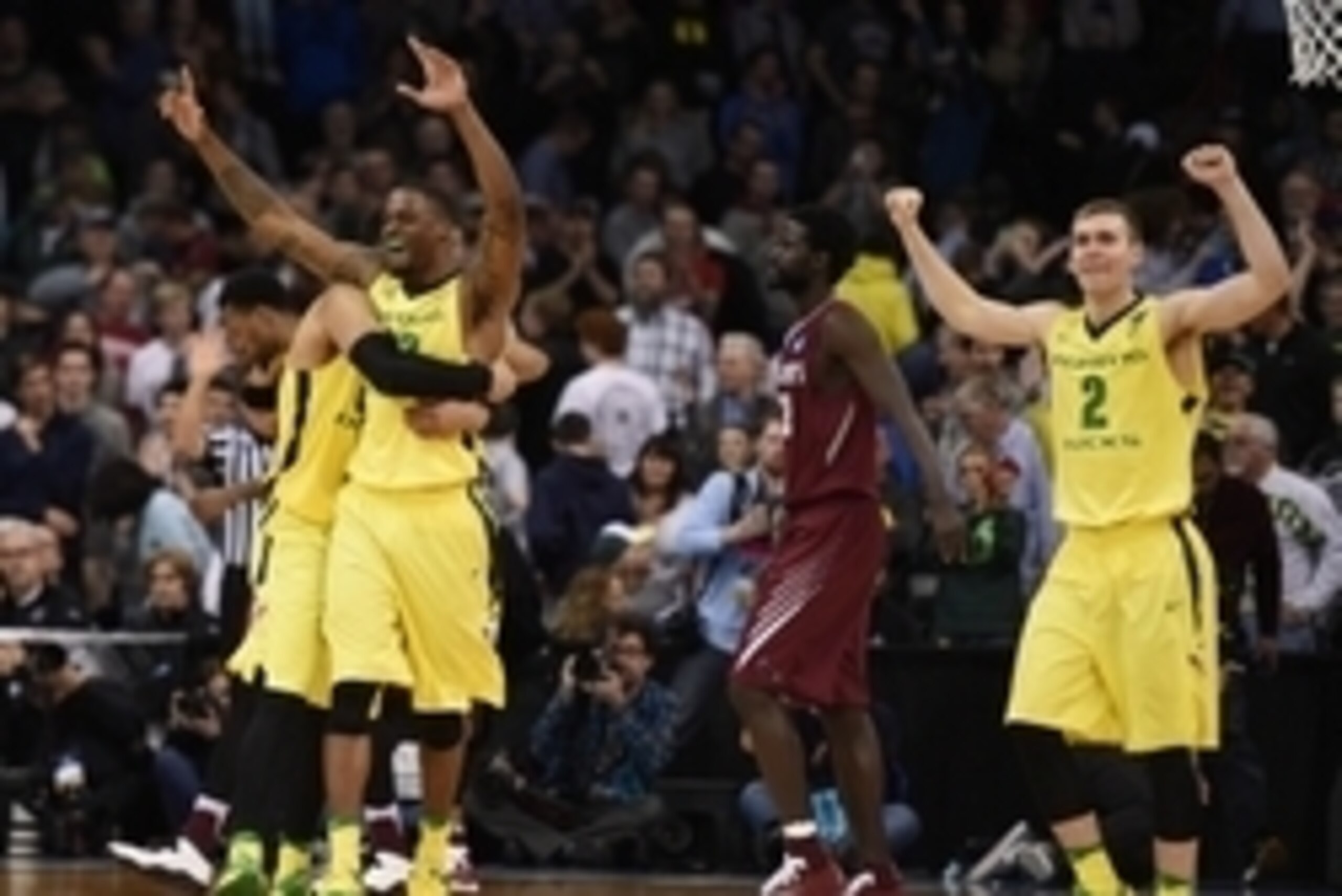 March 20, 2016; Spokane , WA, USA; Oregon Ducks forward Elgin Cook (23) and guard Casey Benson (2) celebrate the 69-64 victory against St. Joseph's Hawks during the second half in the second round of the 2016 NCAA Tournament at Spokane Veterans Memorial A