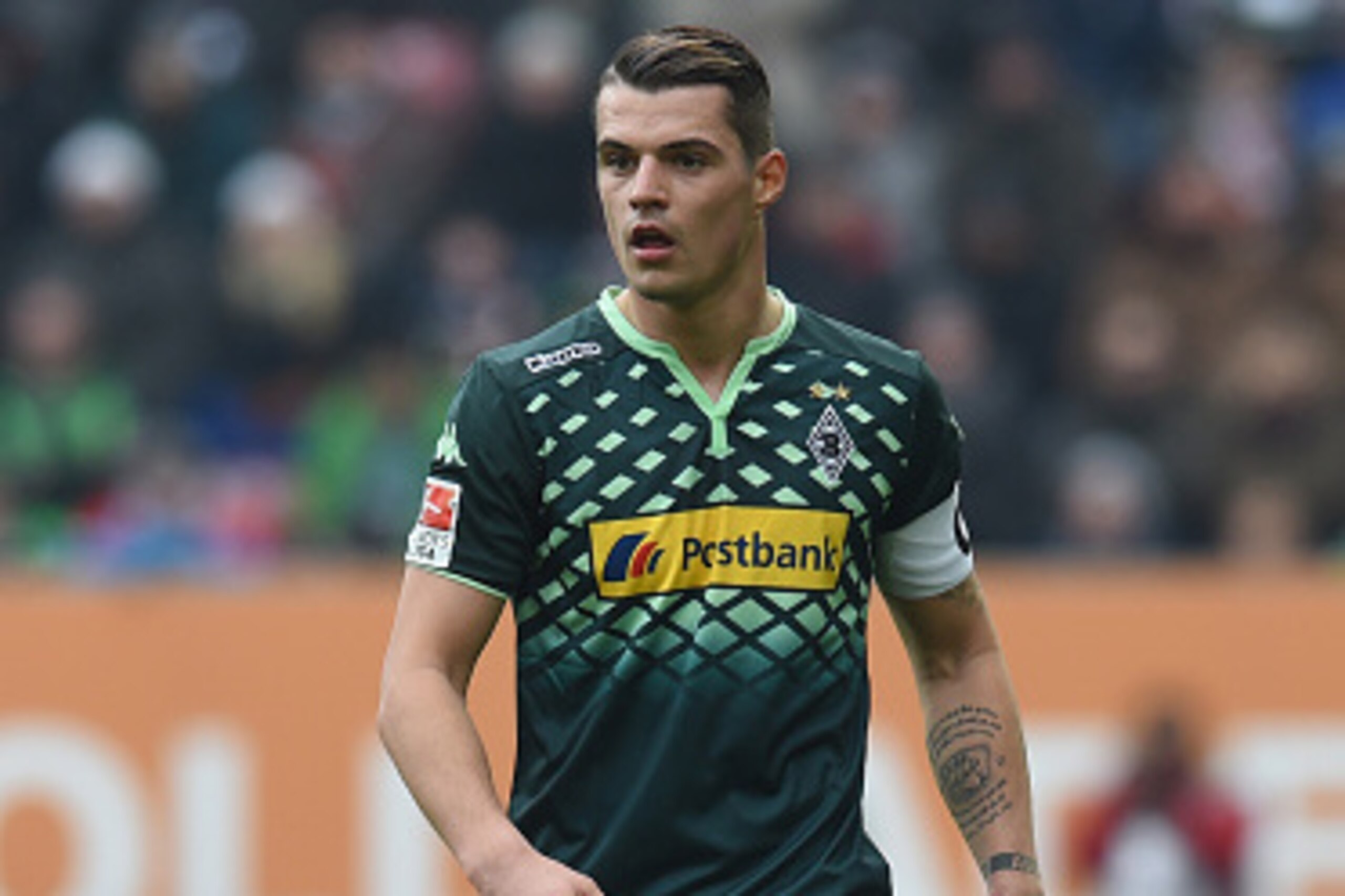 Moenchengladbach's Swiss midfielder Granit Xhaka plays the ball during the German first division Bundesliga football match of FC Augsburg vs Borussia Moenchengladbach in Augsburg, southern Germany, on February 28, 2016.

RESTRICTIONS: DURING MATCH TIME: D