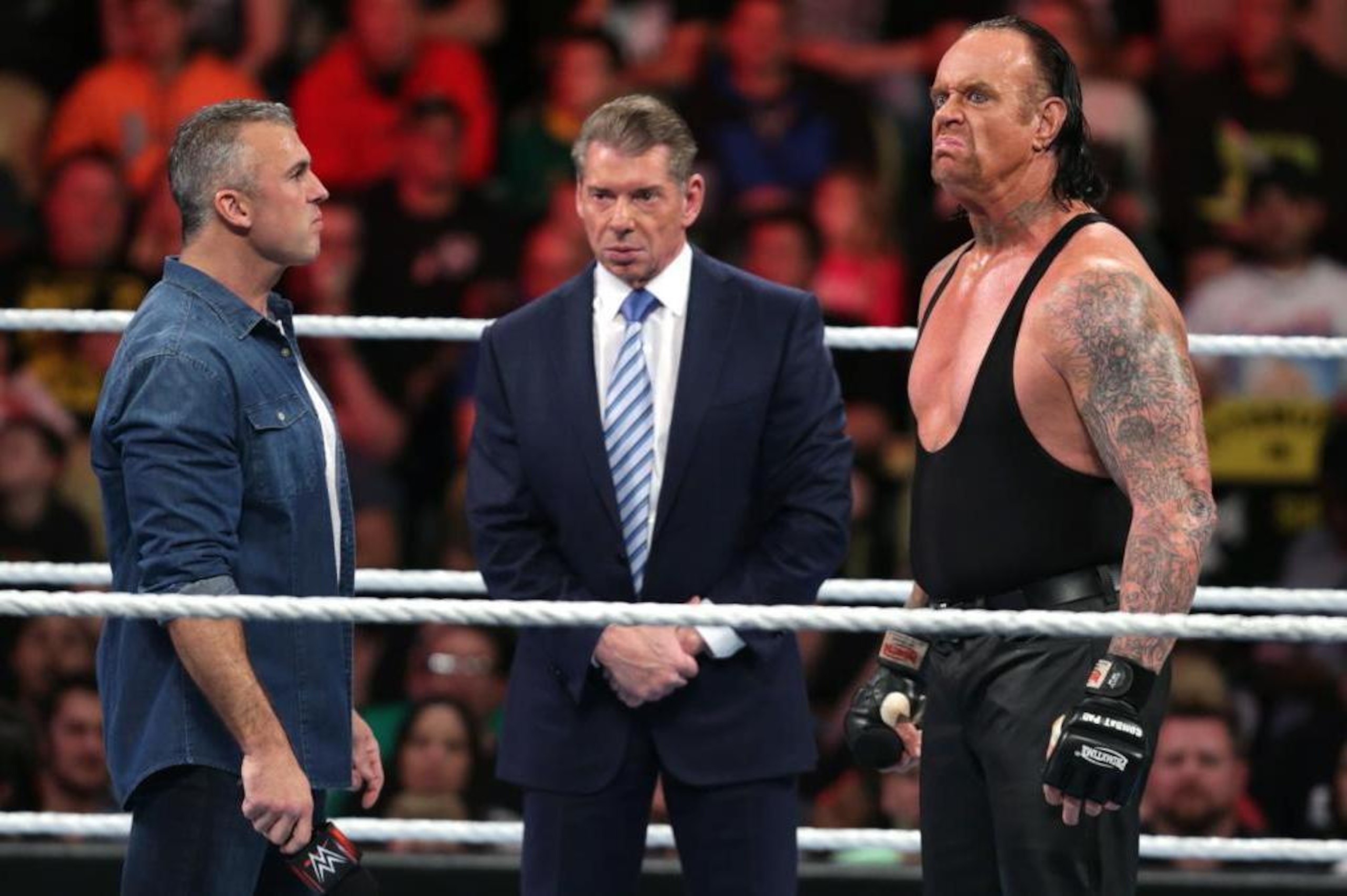 With Vince McMahon watching on, Shane McMahon confronts Undertaker.