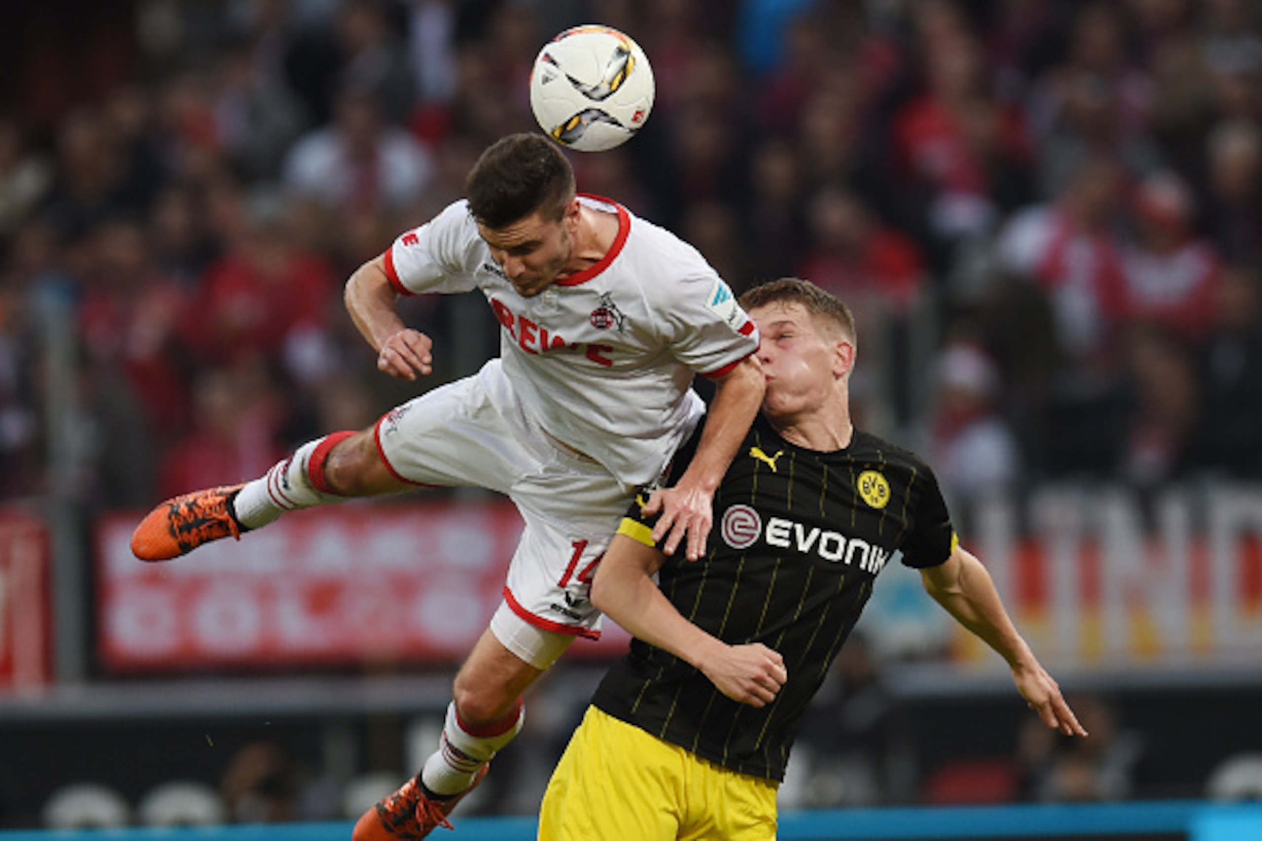 Cologne's defender Jonas Hector (L) vies Dortmund's defender Matthias Ginter during the German first division Bundesliga football match 1 FC Cologne vs Borussia Dortmund in Cologne, western Germany, on December 19, 2015. 

 / AFP / PATRIK STOLLARZ / RESTR