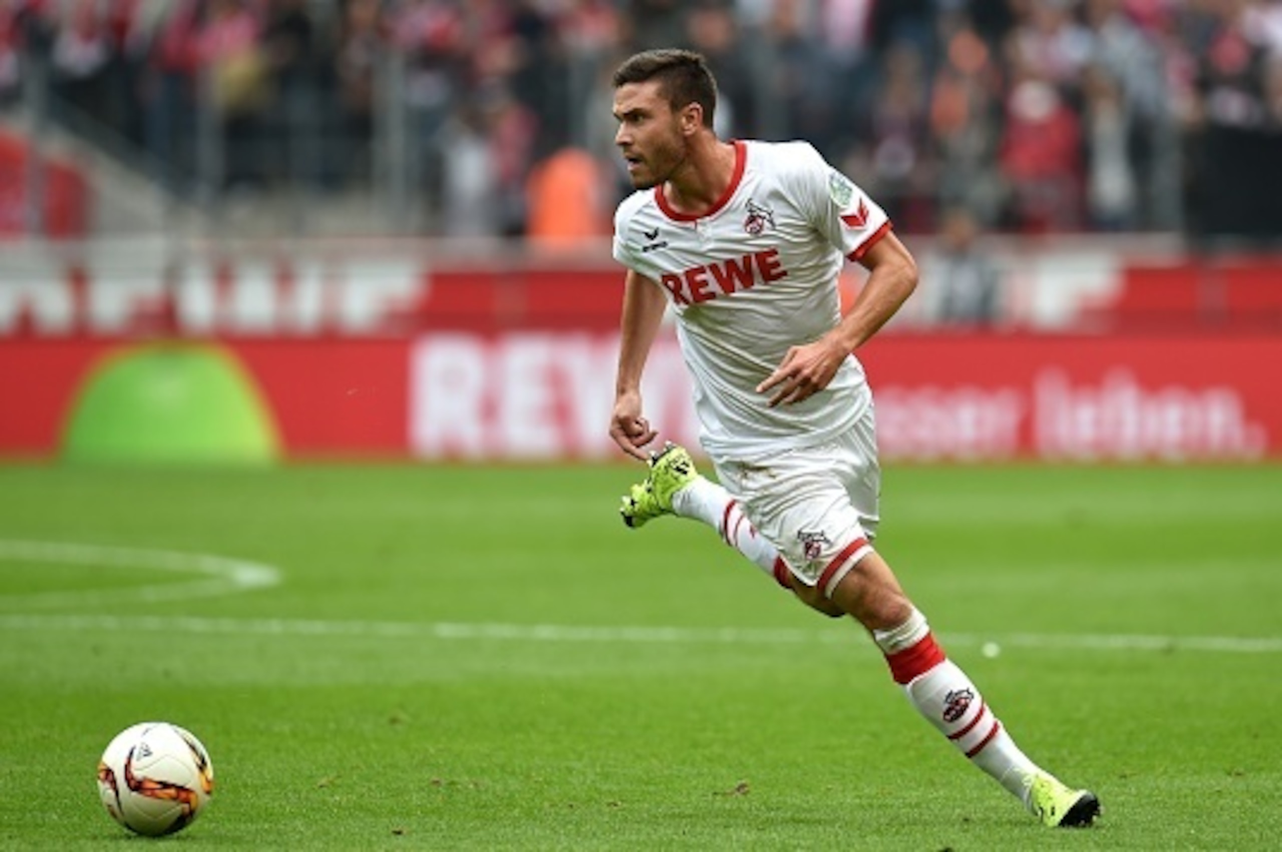 Cologne's defender Jonas Hector runs with the ball during the German first division Bundesliga football match FC Cologne vs Borussia Moenchengladbach in Cologne, western Germany on September 19, 2015. Cologne won the match 1-0.    AFP PHOTO / PATRIK STOLL