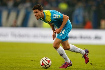 HAMBURG, GERMANY - JANUARY 31:  (L) Jonas Hector of Koeln in action during the First Bundesliga match between Hamburger SV and 1. FC Koeln  at Imtech Arena on January 31, 2015 in Hamburg, Germany.  (Photo by Oliver Hardt/Getty Images)