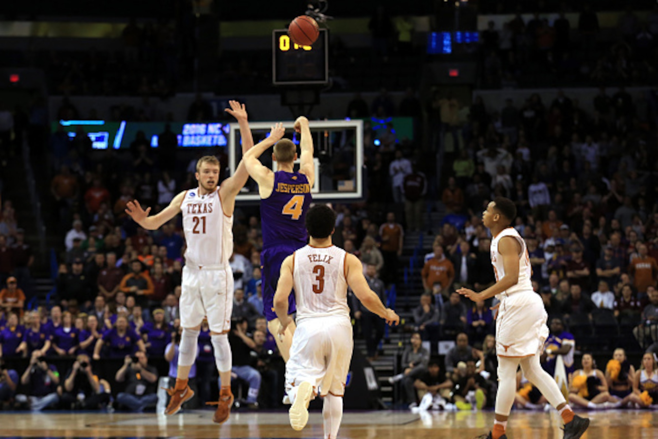 OKLAHOMA CITY, OK - MARCH 18:  Paul Jesperson #4 of the Northern Iowa Panthers hits a half court three pointer at the buzzer to defeat the Texas Longhorns with a score of 75 to 72 during the first round of the 2016 NCAA Men's Basketball Tournament at Ches