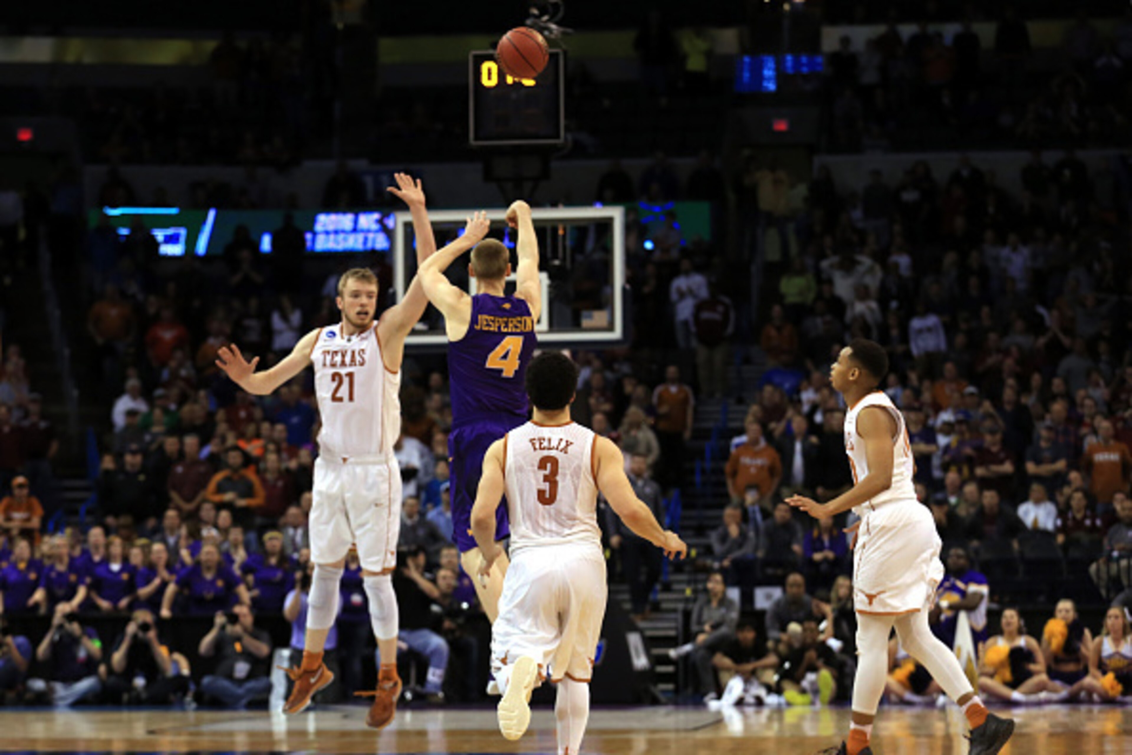 OKLAHOMA CITY, OK - MARCH 18:  Paul Jesperson #4 of the Northern Iowa Panthers hits a half court three pointer at the buzzer to defeat the Texas Longhorns with a score of 75 to 72 during the first round of the 2016 NCAA Men's Basketball Tournament at Ches