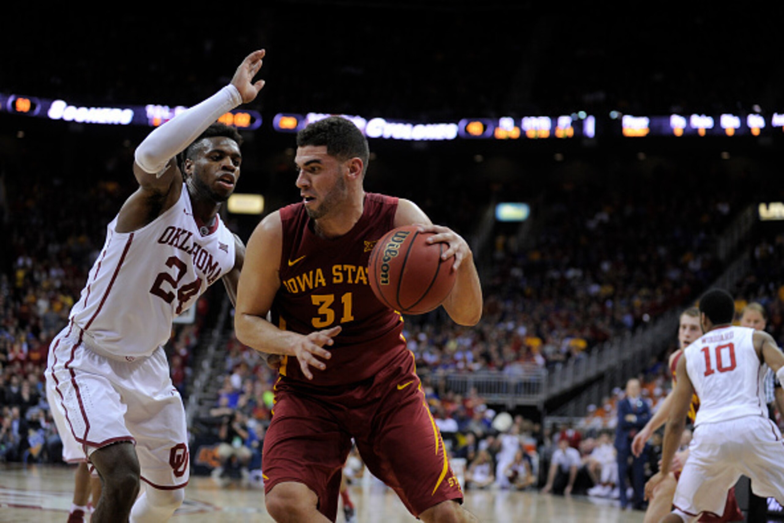 KANSAS CITY, MO - MARCH 10: Georges Niang #31 of the Iowa State Cyclones drives to the basket against Buddy Hield #24 of the Oklahoma Sooners during the quarterfinals of the Big 12 Basketball Tournament at Sprint Center on March 10, 2016 in Kansas City, M