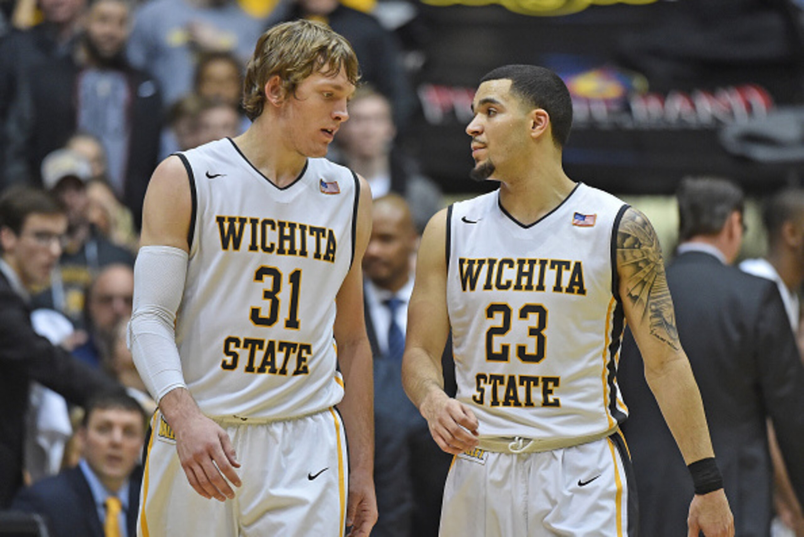 WICHITA, KS - JANUARY 06:  Guard Fred VanVleet #23 of the Wichita State Shockers talks with teammate Ron Baker #31 during the second half against the Evansville Aces on January 6, 2016 at Charles Koch Arena in Wichita, Kansas.  Wichita State defeated Evan