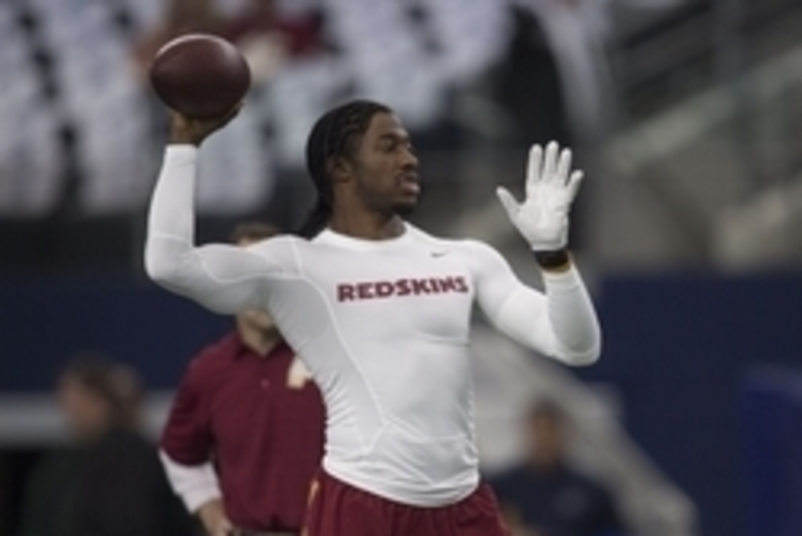 Jan 3, 2016; Arlington, TX, USA; Washington Redskins quarterback Robert Griffin III (10) warms before the game against the Dallas Cowboys at AT&T Stadium. Mandatory Credit: Jerome Miron-USA TODAY Sports