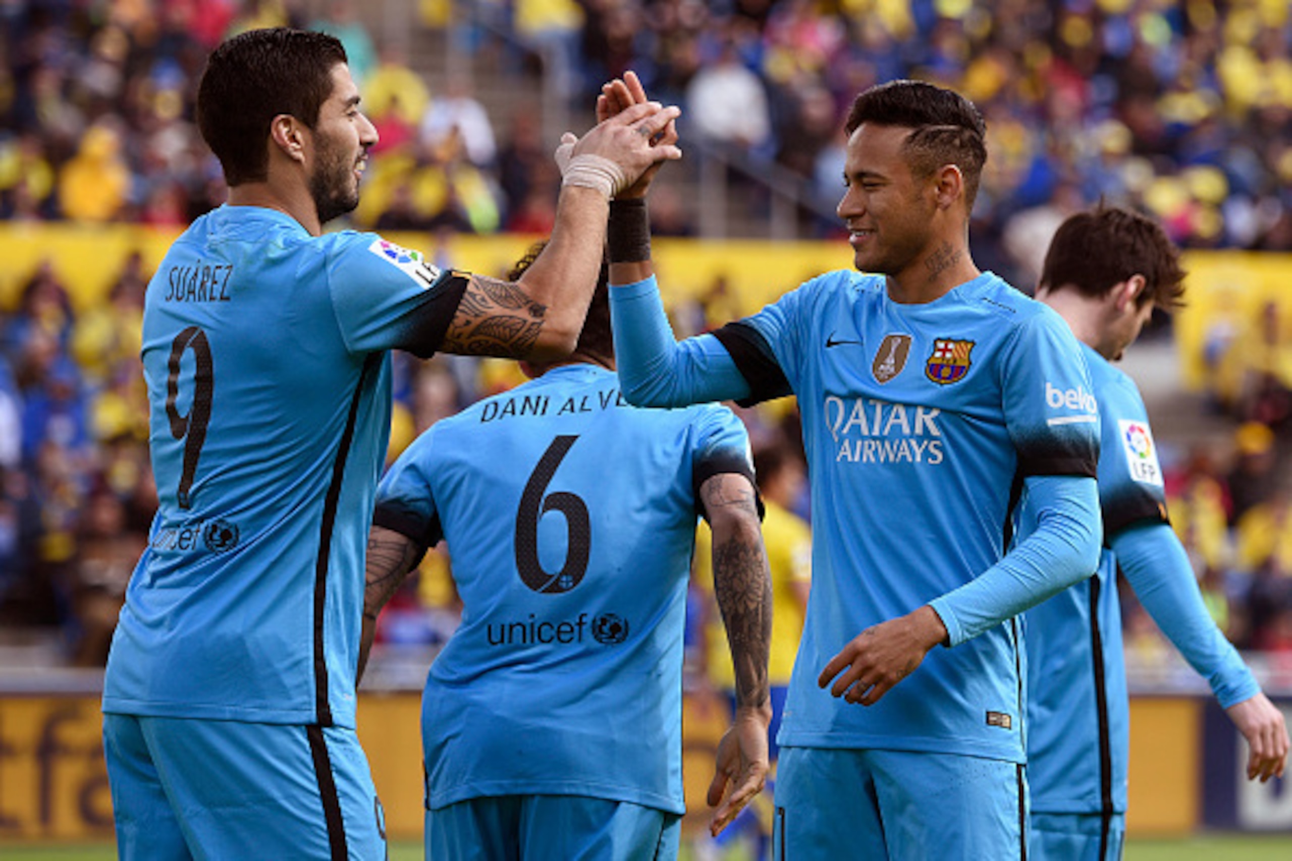 Barcelona's Uruguayan forward Luis Suarez (L) celebrates a goal with Barcelona's Brazilian forward Neymar during the Spanish league football match UD Las Palmas vs FC Barcelona at the Gran Canaria stadium in Las Palmas de Gran Canaria on February 20, 2016