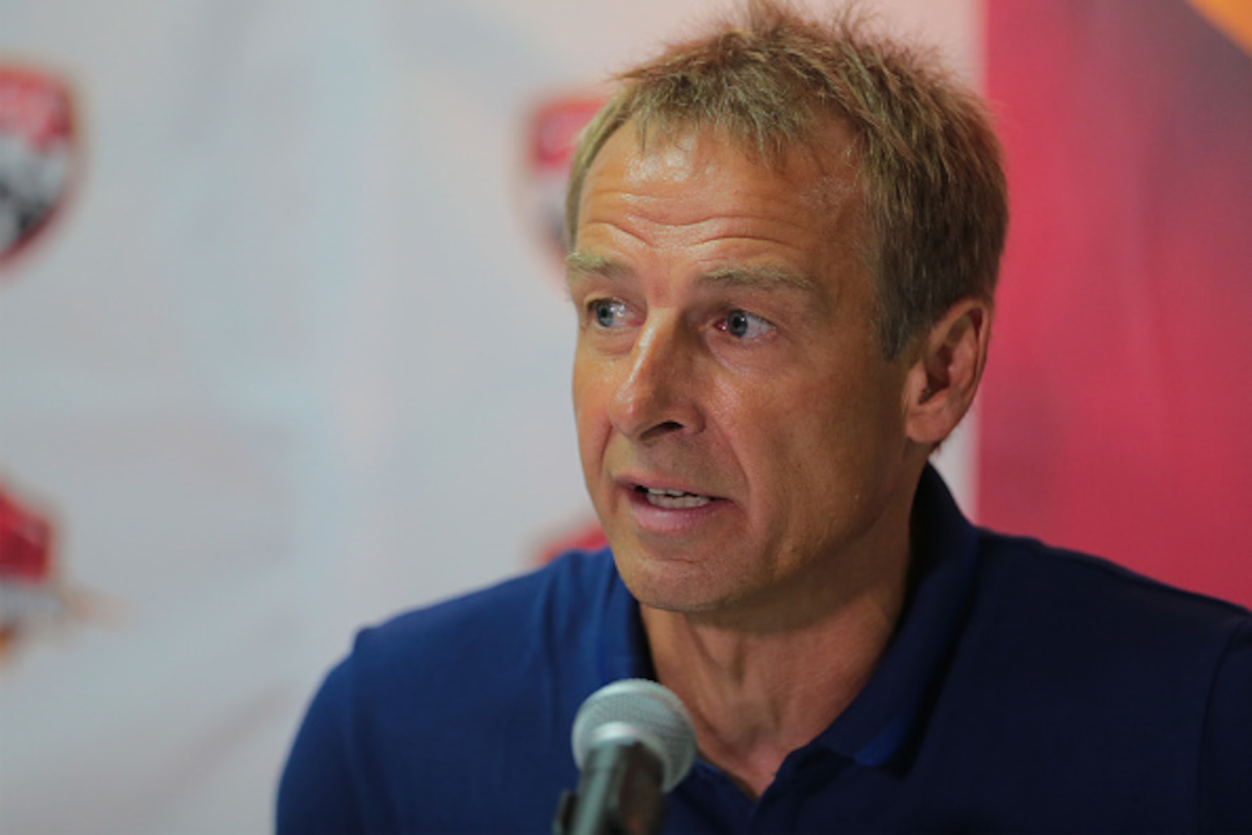 PORT OF SPAIN, TRINIDAD & TOBAGO - NOVEMBER 17: Juergen Klinsmann coach of the USA national team addresses the media at a post match press conference after the World Cup Qualifier between Trinidad and Tobago and USA as part of the FIFA World Cup Qualifier