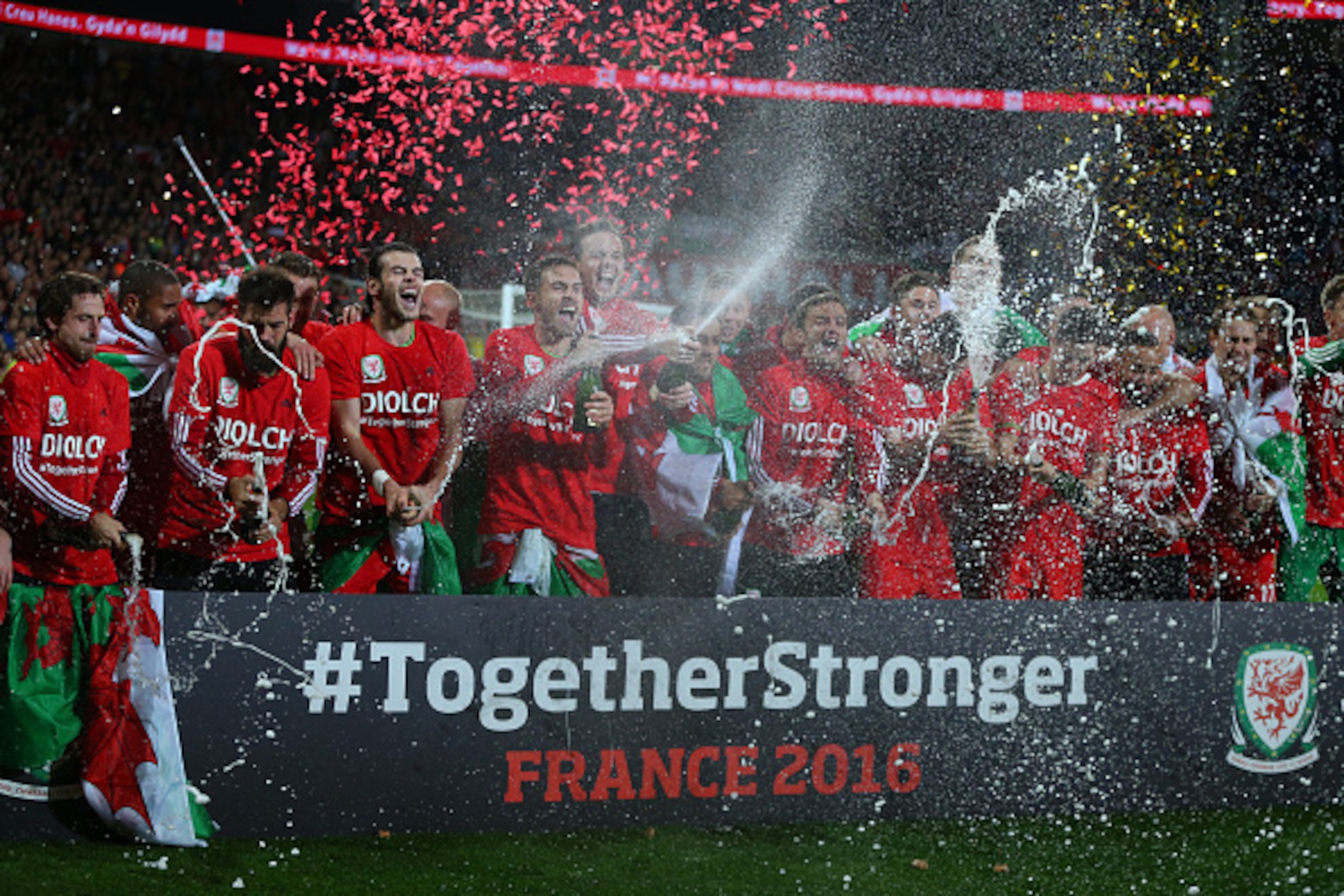 CARDIFF, WALES - OCTOBER 13 : Gareth Bale and Aaron Ramsey of Wales spray champagne as they celebrate alongside their team mates after the UEFA EURO 2016 Qualifier match between Wales and Andorra at Cardiff City Stadium on October 13, 2015 in Cardiff, Uni