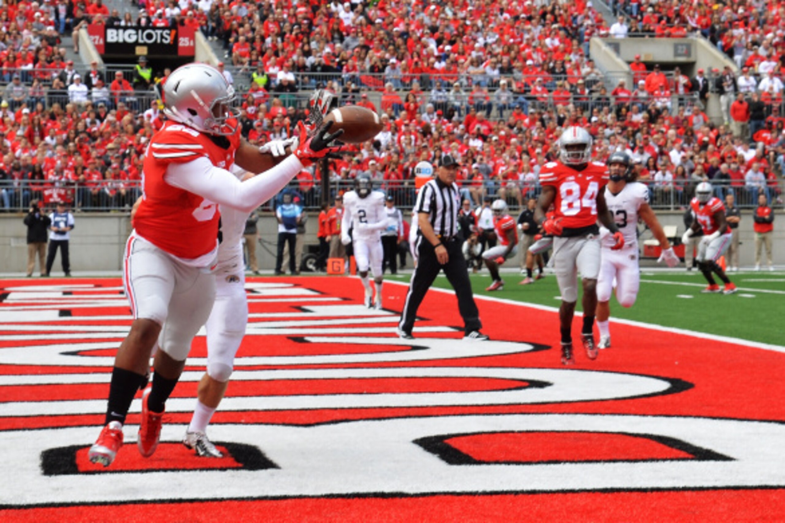 COLUMBUS, OH - SEPTEMBER 13:  Marcus Baugh #85 of the Ohio State Buckeyes catches a two-yard touchdown pass in front of Nate Holley #18 of the Kent State Golden Flashes in the second quarter at Ohio Stadium on September 13, 2014 in Columbus, Ohio.  (Photo