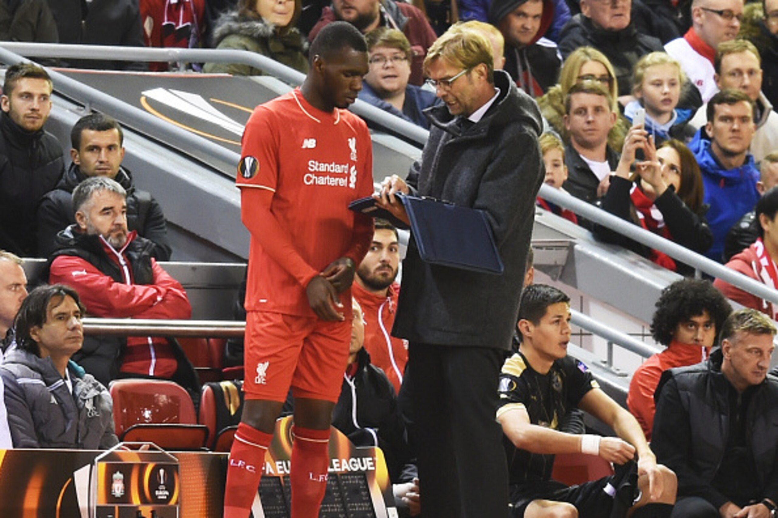 LIVERPOOL, ENGLAND - OCTOBER 22:  Christian Benteke of Liverpool receives instructions from Jurgen Klopp the manager of Liverpool as he prepares to come on as a second half substitute during the UEFA Europa League Group B match between Liverpool FC and Ru