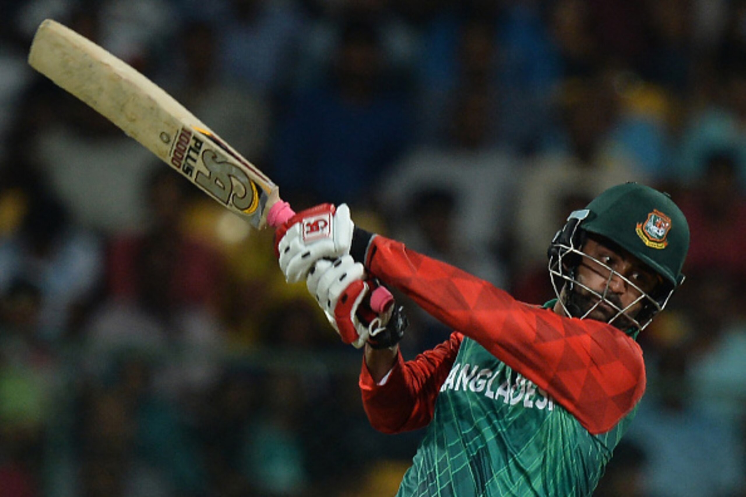 Bangladesh batsman Tamim Iqbal Khan plays a shot during the World T20 cricket tournament match between India and Bangladesh at The Chinnaswamy Stadium in Bangalore on March 23, 2016. 
Bangladesh is chasing a target of 146 runs scored by India with a loss 