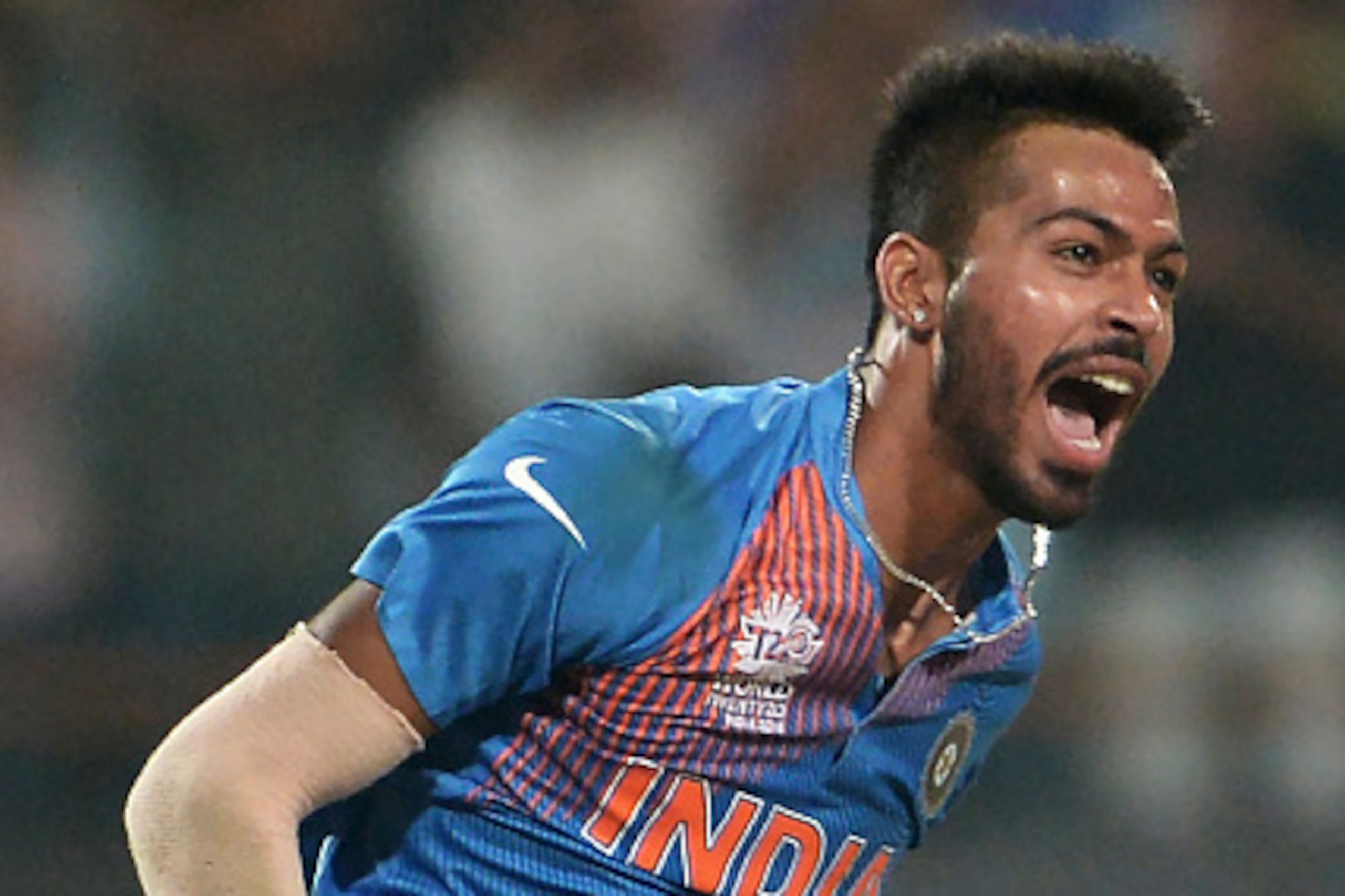India's Hardik Pandya jumps in the air as he celebrates the dismissal of Pakistan's captain Shahid Afridi during the World T20 cricket tournament match between India and Pakistan  at The Eden Gardens Cricket Stadium  in Kolkata on March 19, 2016. / AFP / 