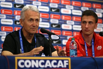 COMMERCE CITY, CO - OCTOBER 05:  Head coach Benito Floro (L) of the Canadian U-23 men's soccer team addresses the media along with player Luca Gasparotto (R) during a press conference ahead of the 2015 CONCACAF Olympic Qualifying group play matches at Dic