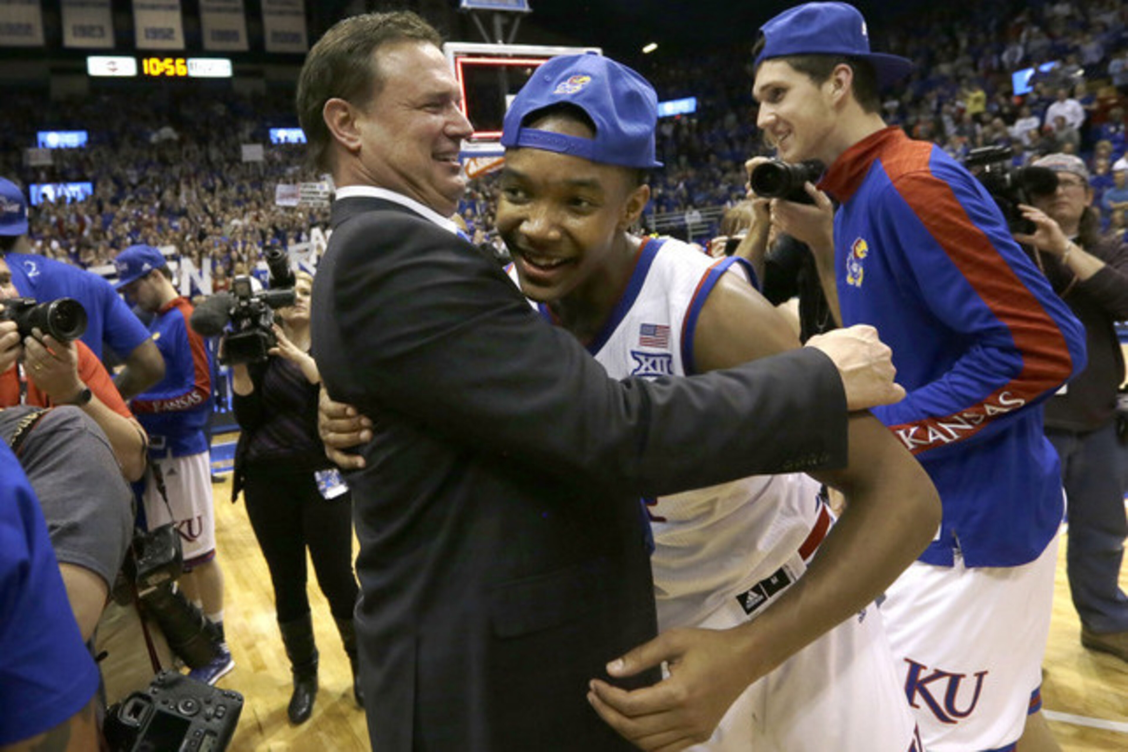 Bill Self and Devonte' Graham celebrate Kansas' win in the 2015 Big 12 conference championship. Bill Self and Devonte' Graham celebrate Kansas' win in the 2015 Big 12 conference championship.