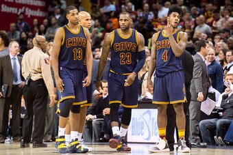 CLEVELAND, OH - FEBRUARY 5: Tristan Thompson #13 LeBron James #23 and Iman Shumpert #4 of the Cleveland Cavaliers pause on the court during the second half against the Boston Celtics at Quicken Loans Arena on February 5, 2016 in Cleveland, Ohio. The Celti