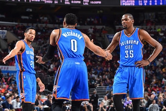 PHILADELPHIA,PA - MARCH 18:  Kevin Durant #35 and  Russell Westbrook #0 and Andre Roberson #21 of the Oklahoma City Thunder shake hands against the Philadelphia 76ers at Wells Fargo Center on March 18, 2016 in Philadelphia, Pennsylvania NOTE TO USER: User