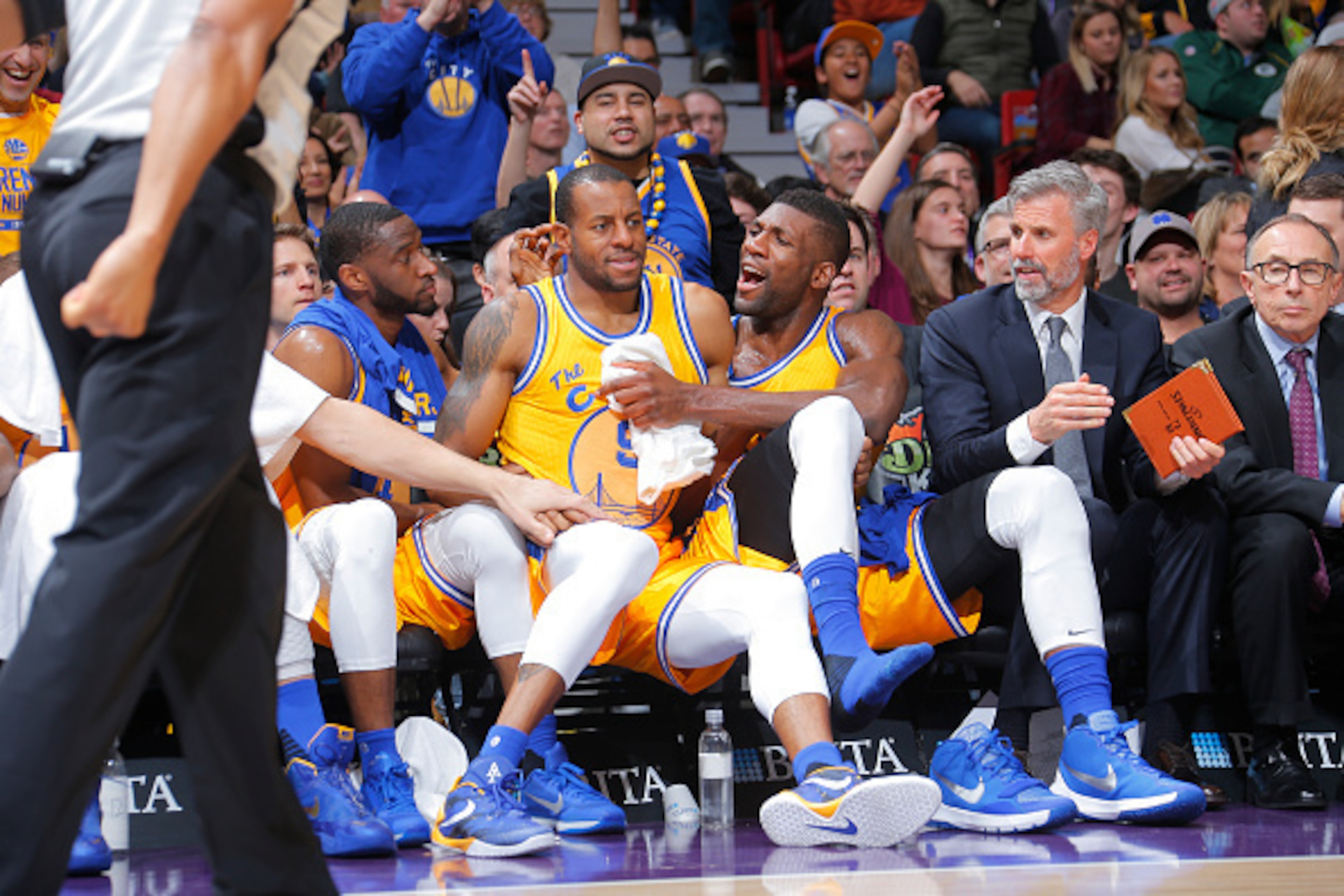 SACRAMENTO, CA - JANUARY 9: Andre Iguodala #9 of the Golden State Warriors falls onto Ian Clark #21 and Festus Ezeli #31 after shooting a three pointer against the Sacramento Kings on January 9, 2016 at Sleep Train Arena in Sacramento, California. NOTE TO SACRAMENTO, CA - JANUARY 9: Andre Iguodala #9 of the Golden State Warriors falls onto Ian Clark #21 and Festus Ezeli #31 after shooting a three pointer against the Sacramento Kings on January 9, 2016 at Sleep Train Arena in Sacramento, California. NOTE TO