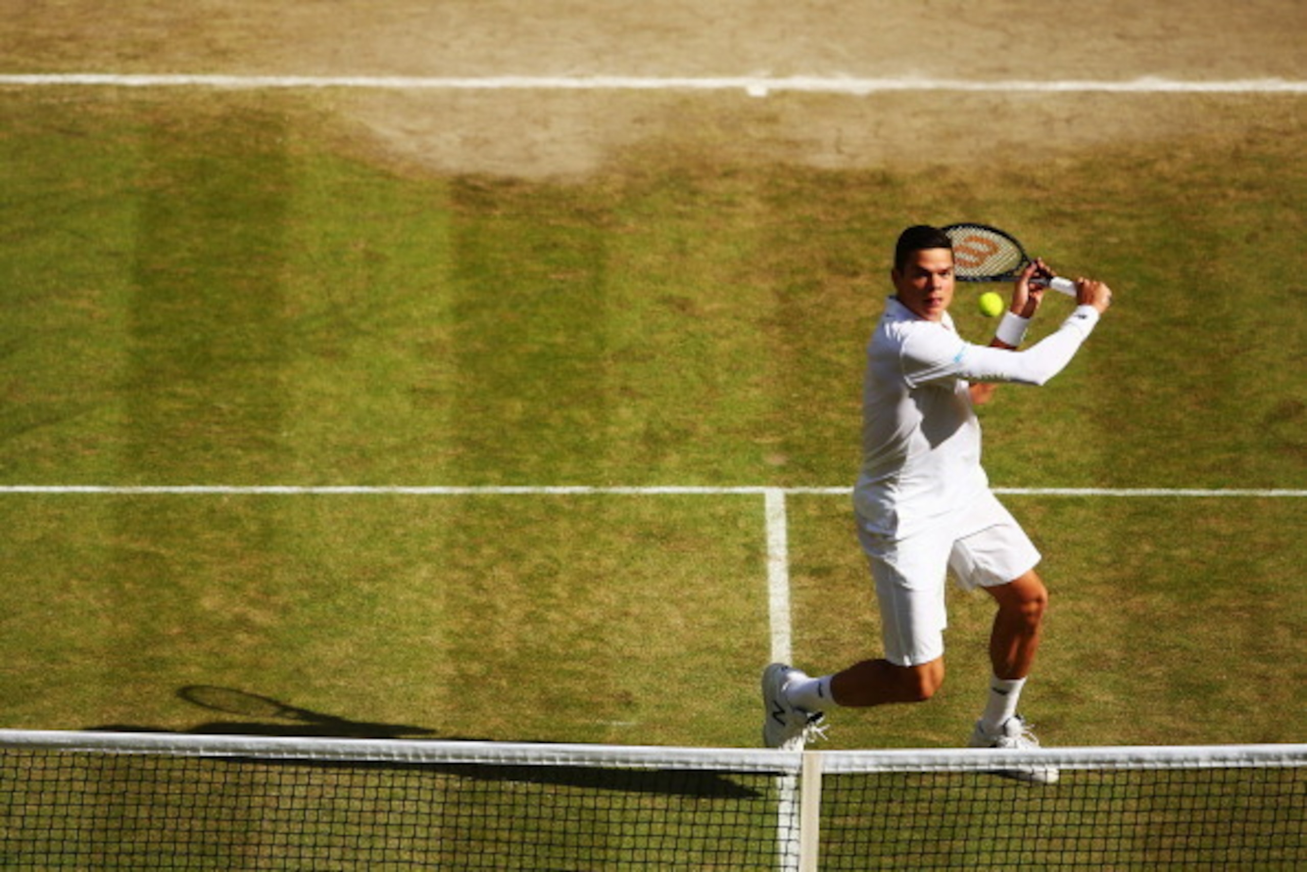 LONDON, ENGLAND - JULY 04:  Milos Raonic of Canada during his Gentlemen's Singles semi-final match against Roger Federer of Switzerland on day eleven of the Wimbledon Lawn Tennis Championships at the All England Lawn Tennis and Croquet Club on July 4, 201