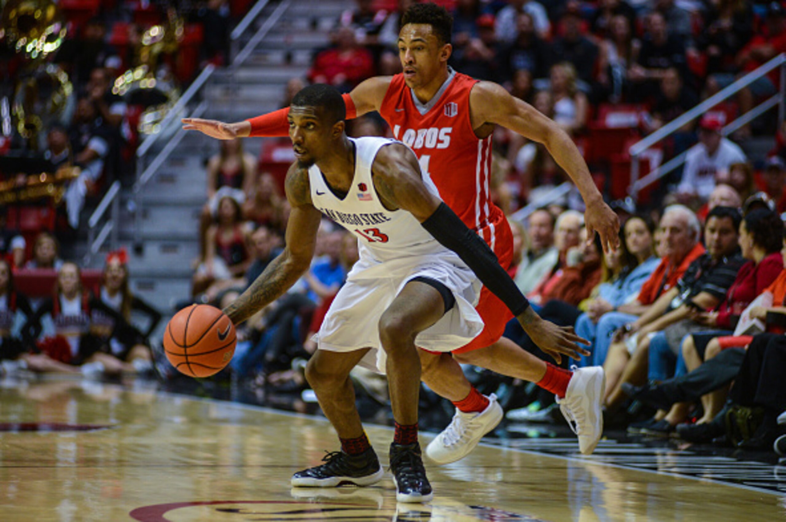 SAN DIEGO, CA - FEBRUARY 06:  Winston Shepard #13  of the San Diego State Aztecs dribbles  the ball in the second half after stealing possession of the ball against the New Mexico Lobos at Viejas Arena on February 6, 2016 in San Diego, California.  (Photo