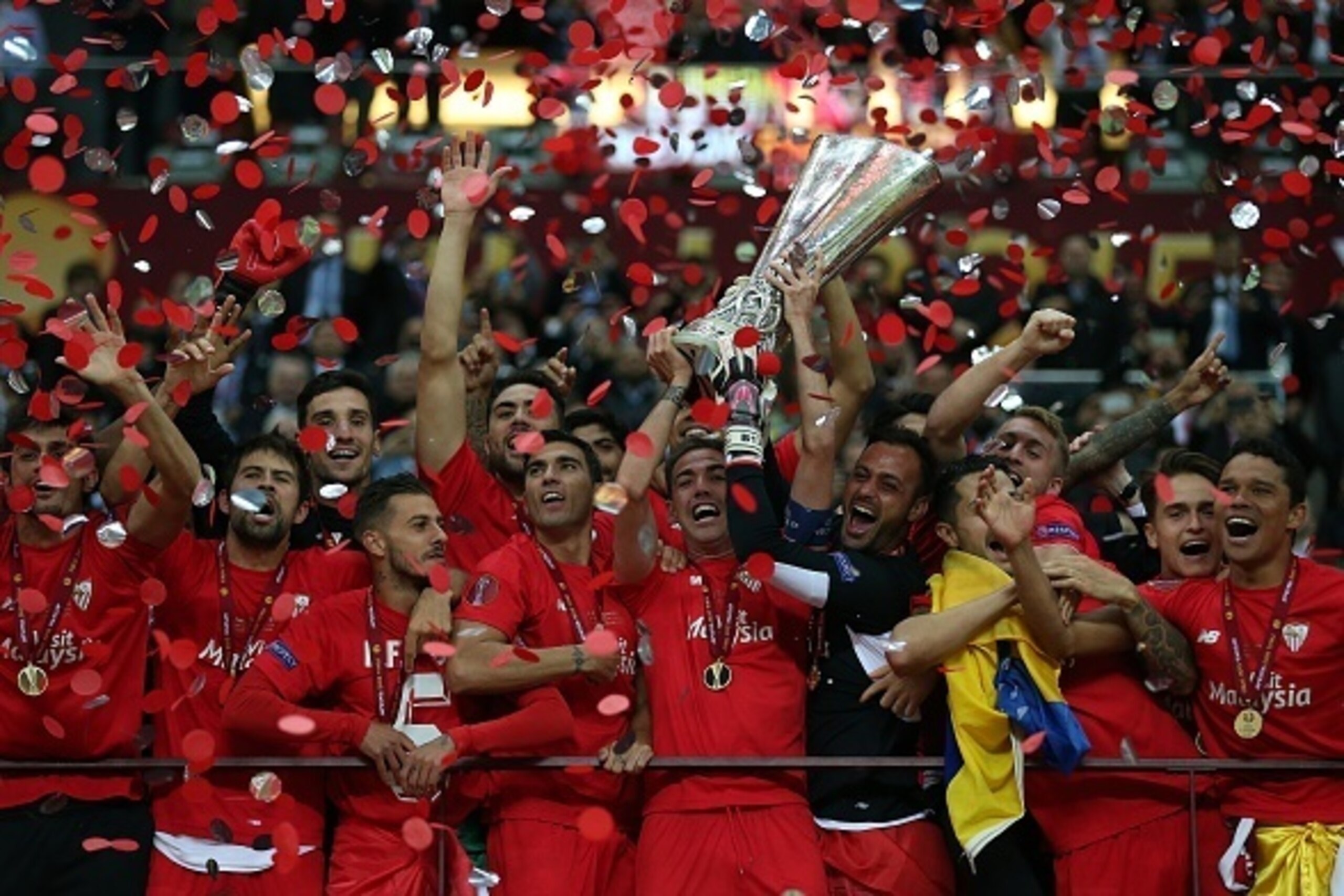 WARSAW, POLAND - MAY 27: Fernando Navarro of FC Sevilla lifts the trophy following the UEFA Europa League Final match between FC Dnipro Dnipropetrovsk and FC Sevilla at the National Stadium on May 27, 2015 in Warsaw, Poland. (Photo by Chris Brunskill Ltd/