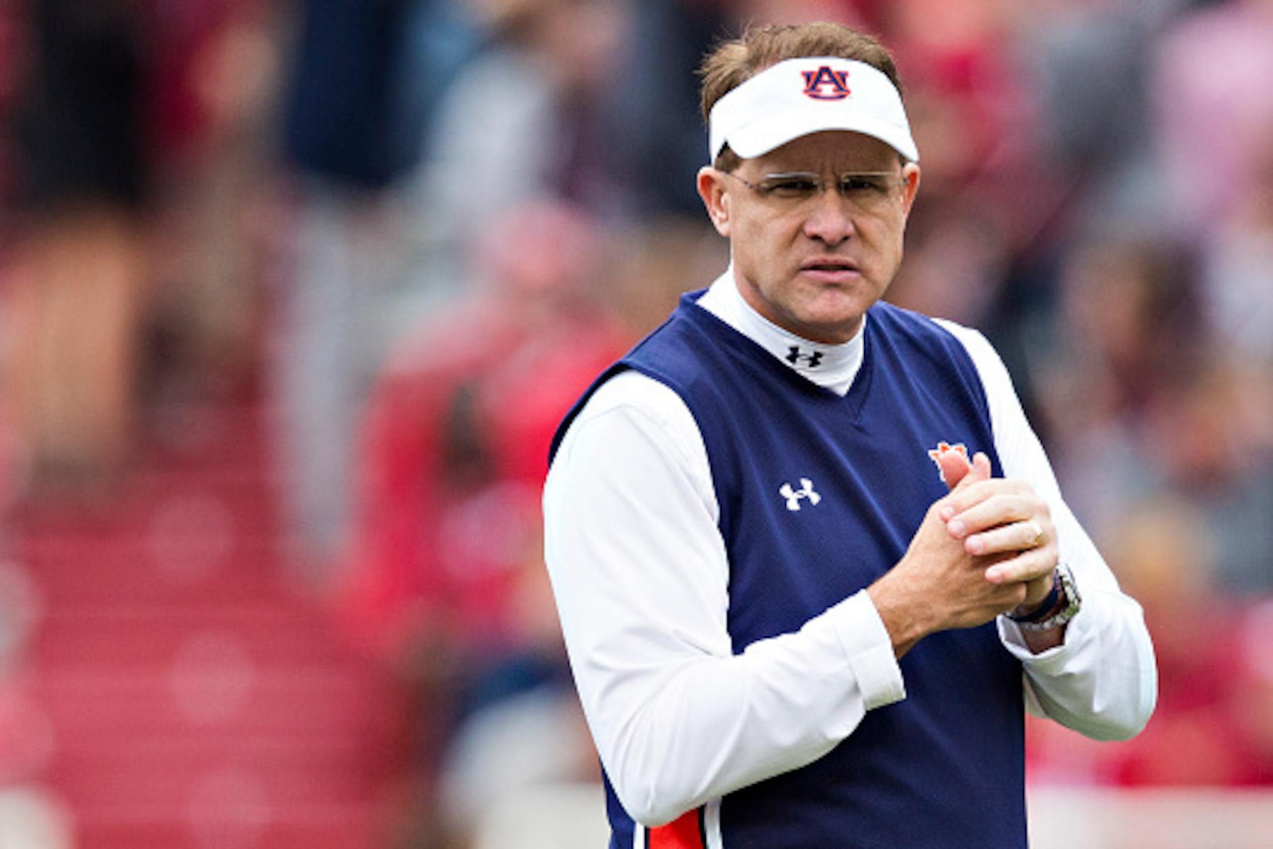 FAYETTEVILLE, AR - OCTOBER 24:  Head Coach Gus Malzahn of the Auburn Tigers watches his team warm up before a game against the Arkansas Razorbacks at Razorback Stadium Stadium on October 24, 2015 in Fayetteville, Arkansas.  The Razorbacks defeated the Tig